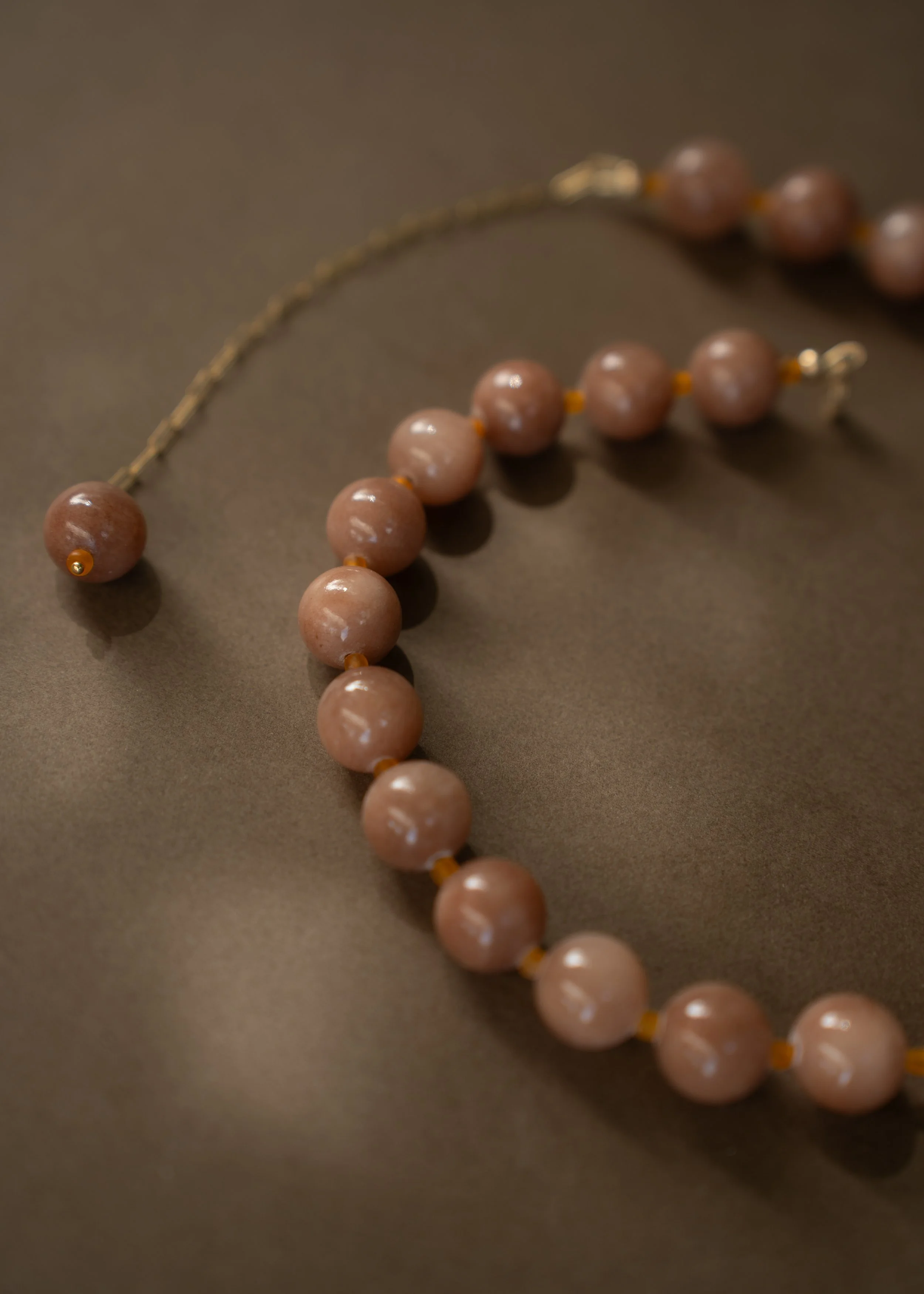 Sunstone Necklace. Large, glossy pink sunstone gemstone beads spaced with citrine. Finished with 14ct gold filled findings. Ochre Jewellery, handmade Byron Bay.
