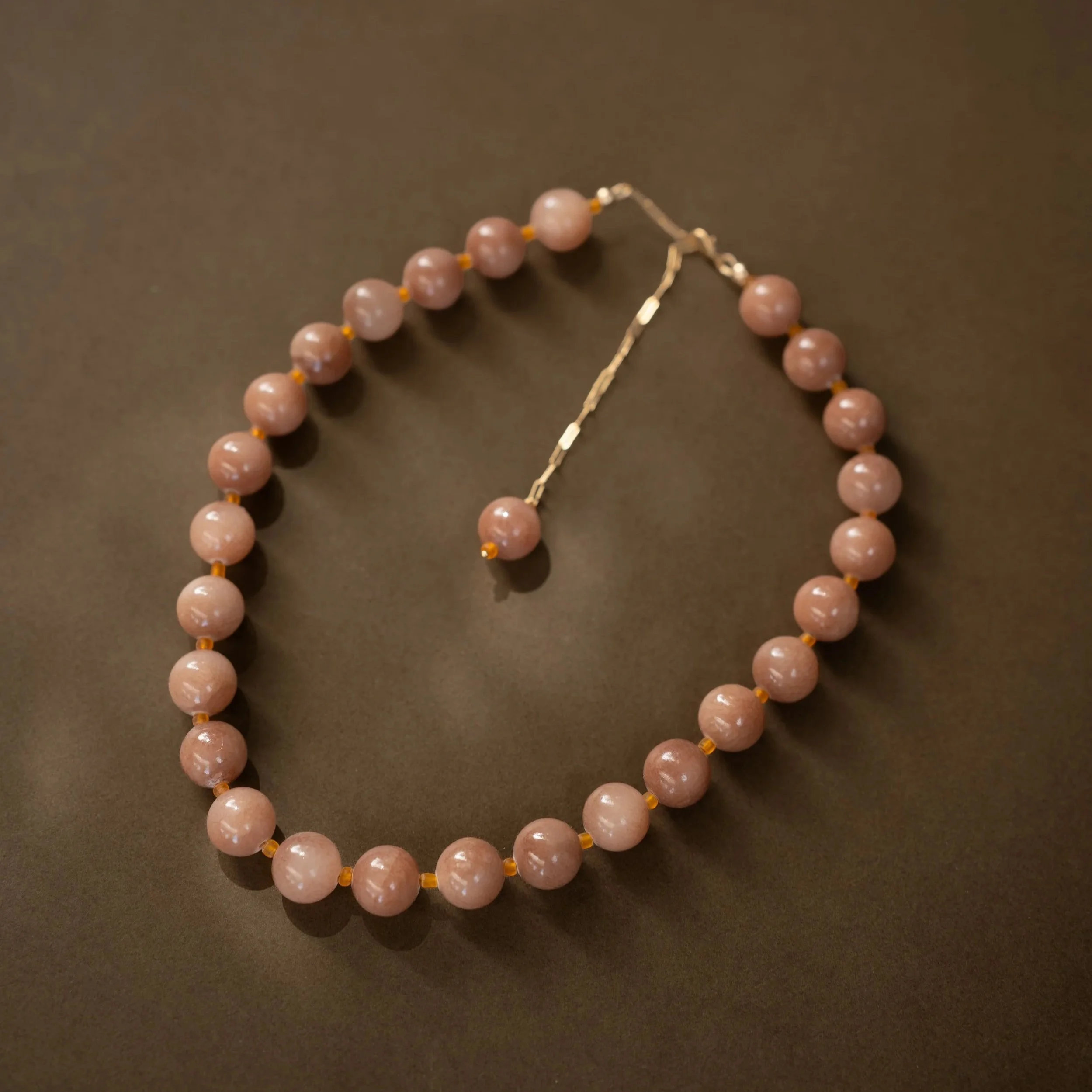 Sunstone Necklace. Large, glossy pink sunstone gemstone beads spaced with citrine. Finished with 14ct gold filled findings. Ochre Jewellery, handmade Byron Bay.