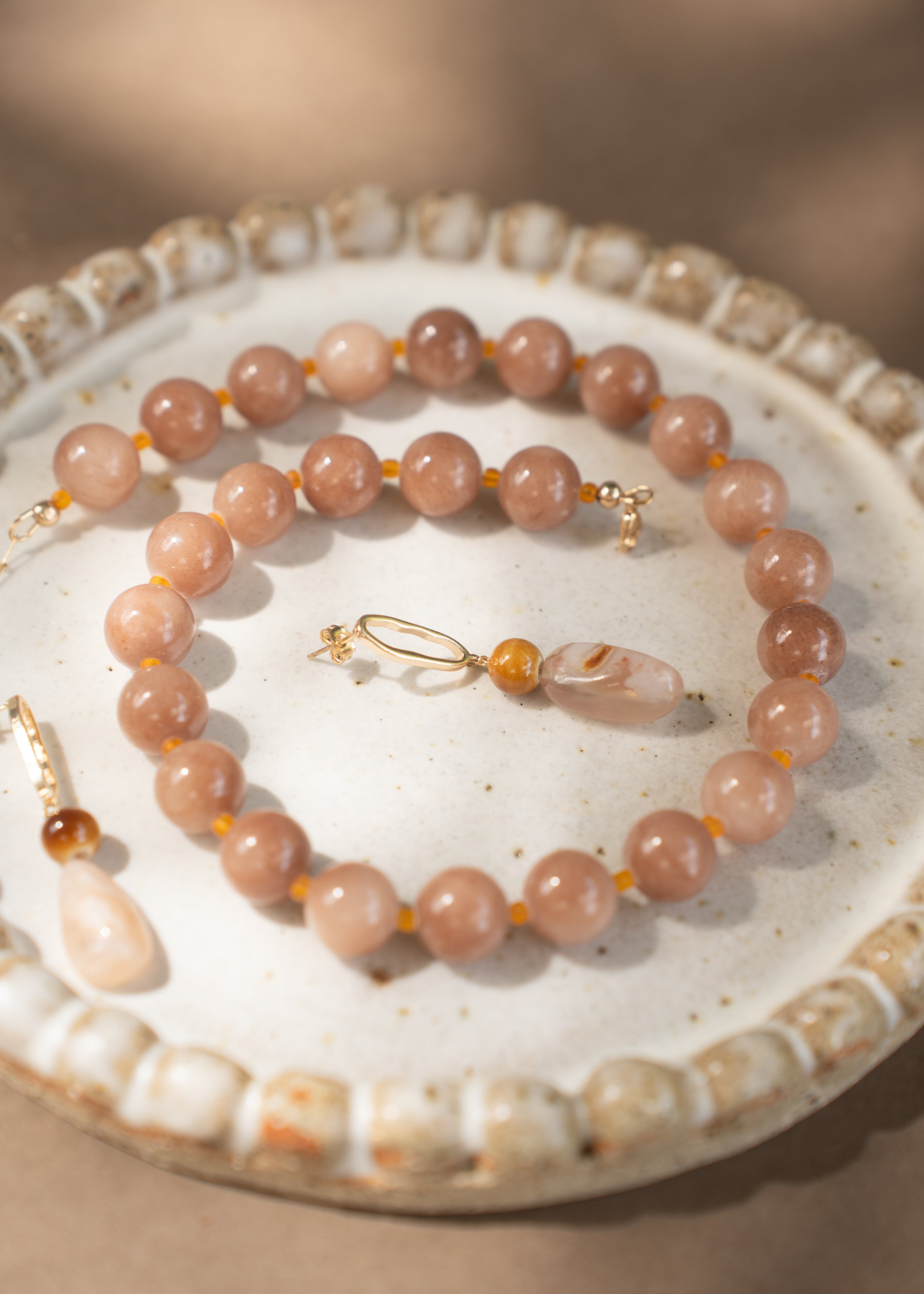 Sunstone Necklace. Large, glossy pink sunstone gemstone beads spaced with citrine. Finished with 14ct gold filled findings. Ochre Jewellery, handmade Byron Bay.