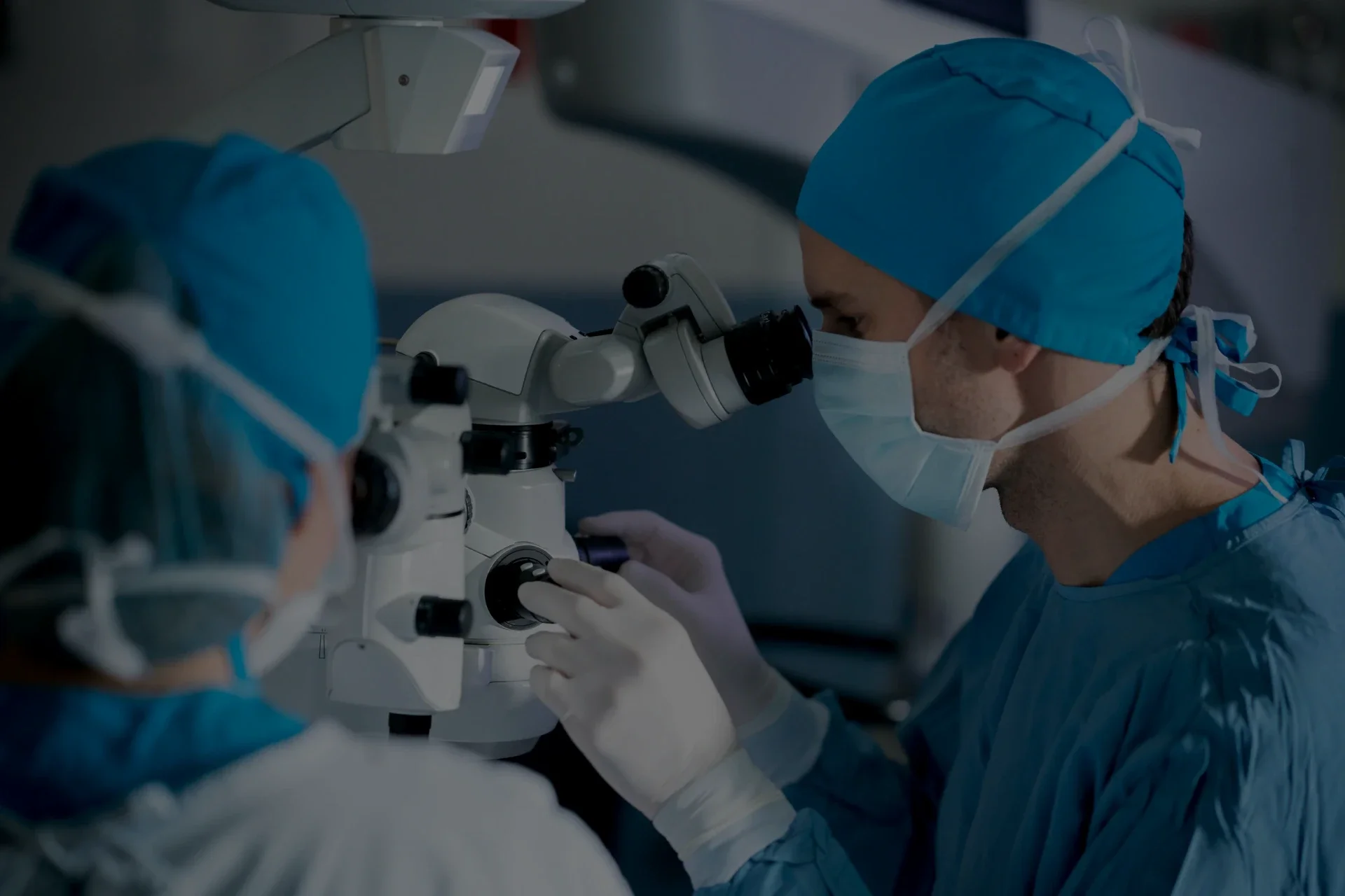 Ophthalmologist using a surgical microscope during an eye procedure..webp