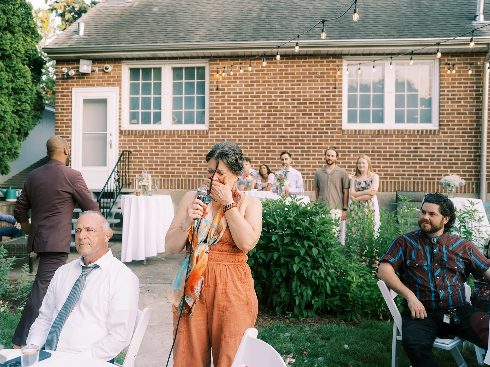 Photo of mom crying during speeches at St. Paul Backyard Wedding