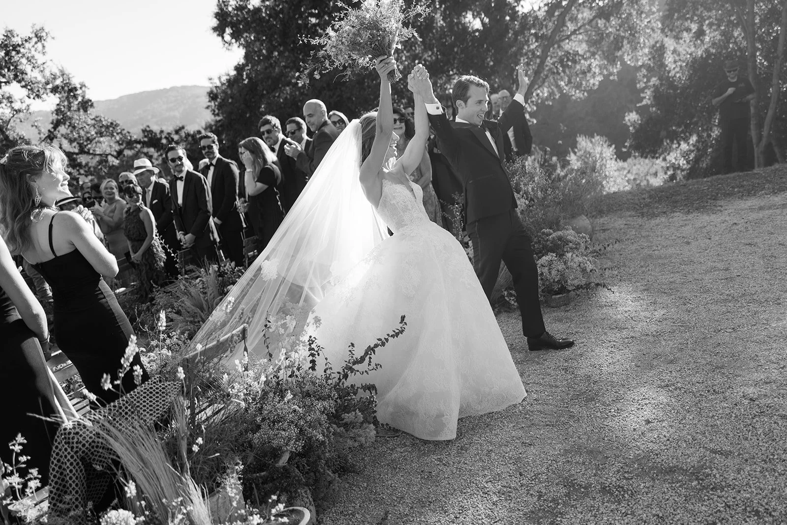 Film photo of Bride and Groom celebrating after their wedding ceremony