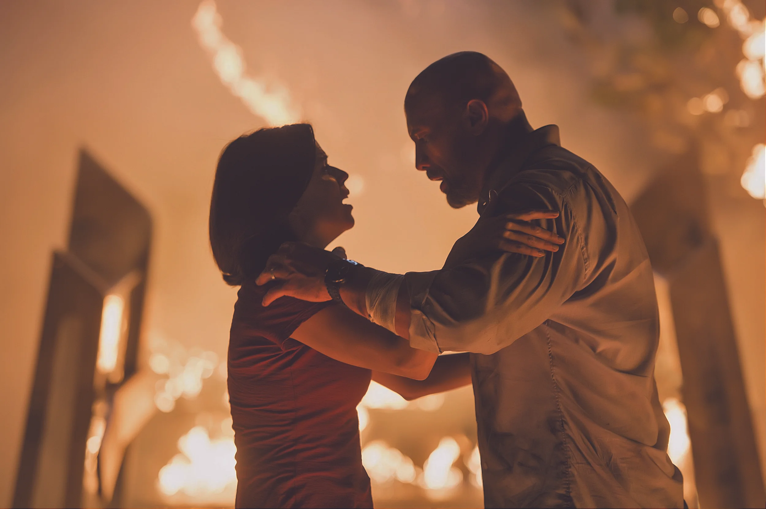 Neve Campbell and Dwayne "The Rock" Johnson in "Skyscraper." (Photo courtesy Kimberley French/Legendary Pictures/Universal)