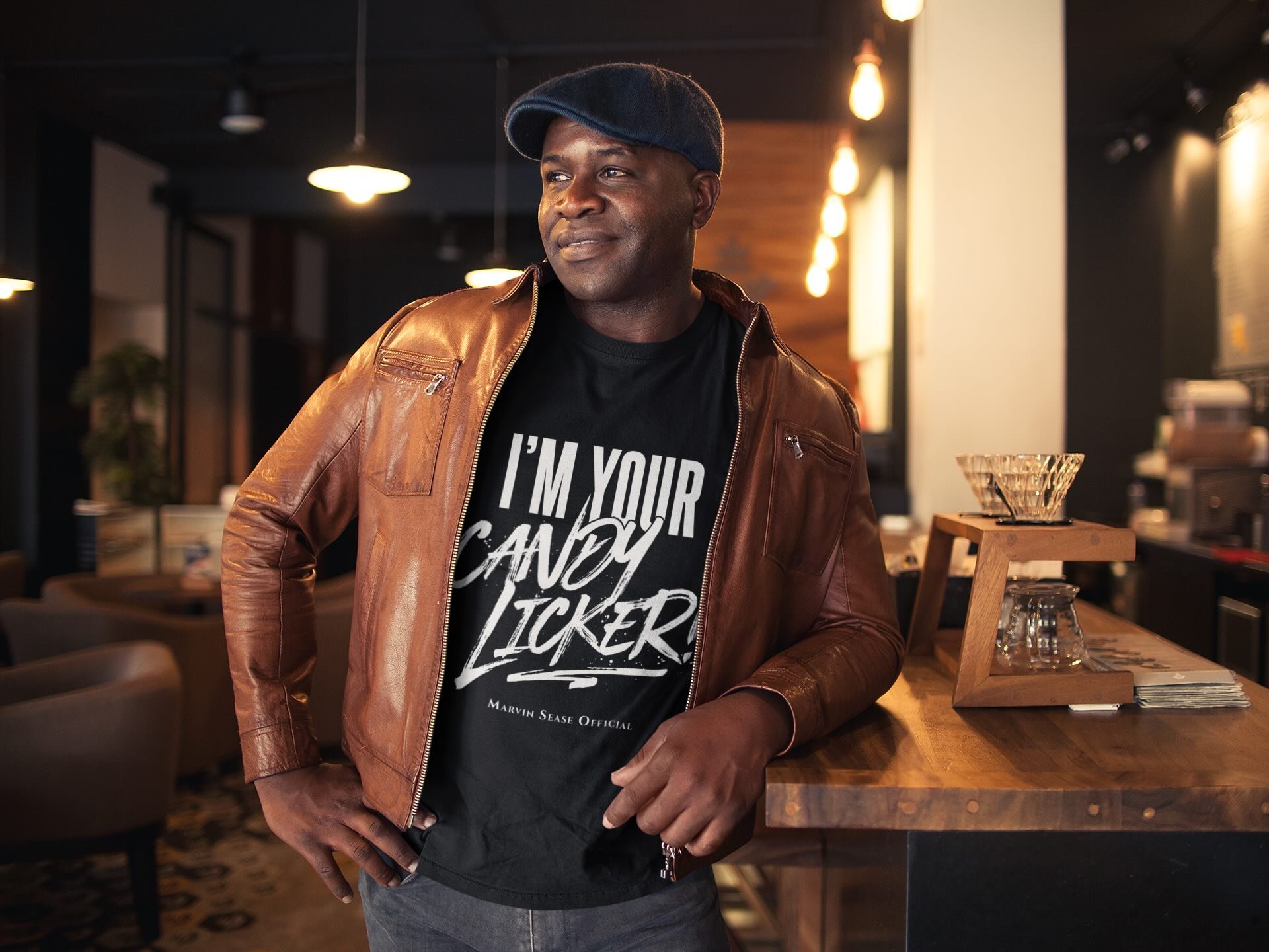 mockup-of-a-black-man-wearing-a-t-shirt-with-a-brown-leather-jacket-and-a-beret-a21418.jpeg