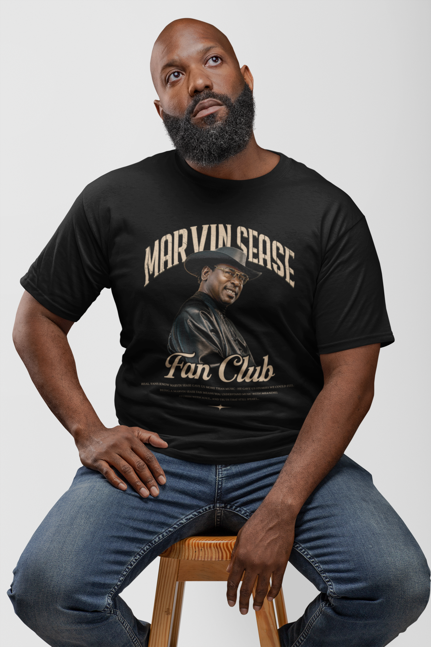 t-shirt-mockup-of-a-sitting-bearded-man-looking-pensive-21527.png
