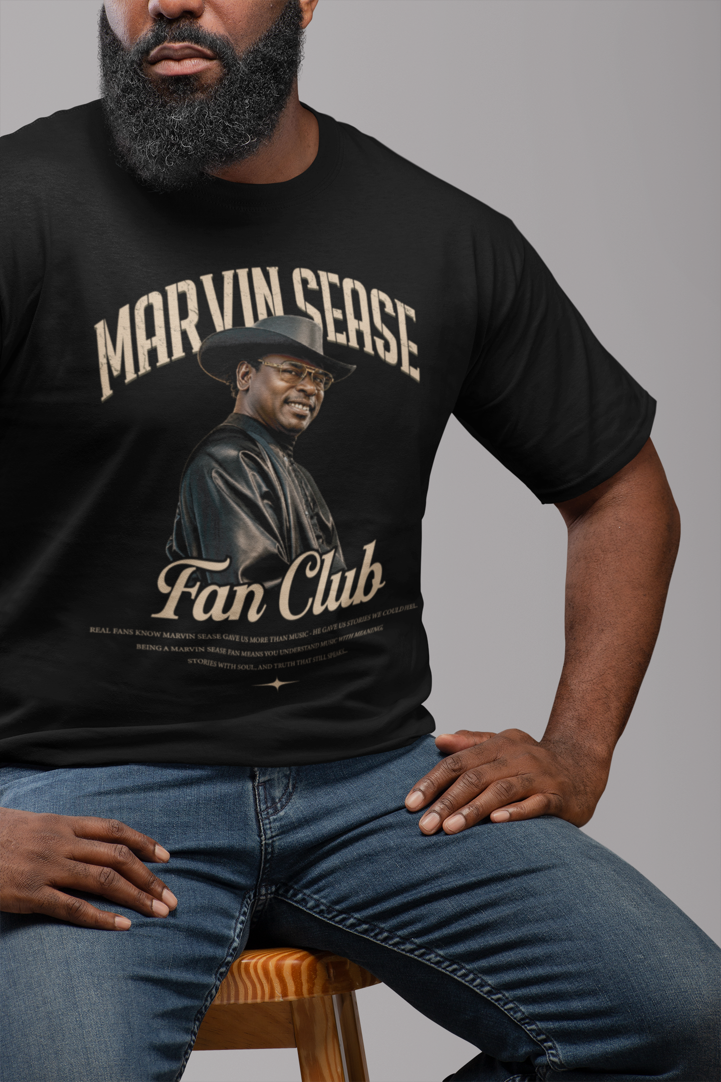 t-shirt-mockup-featuring-a-man-with-a-beard-sitting-on-a-chair-21529.png