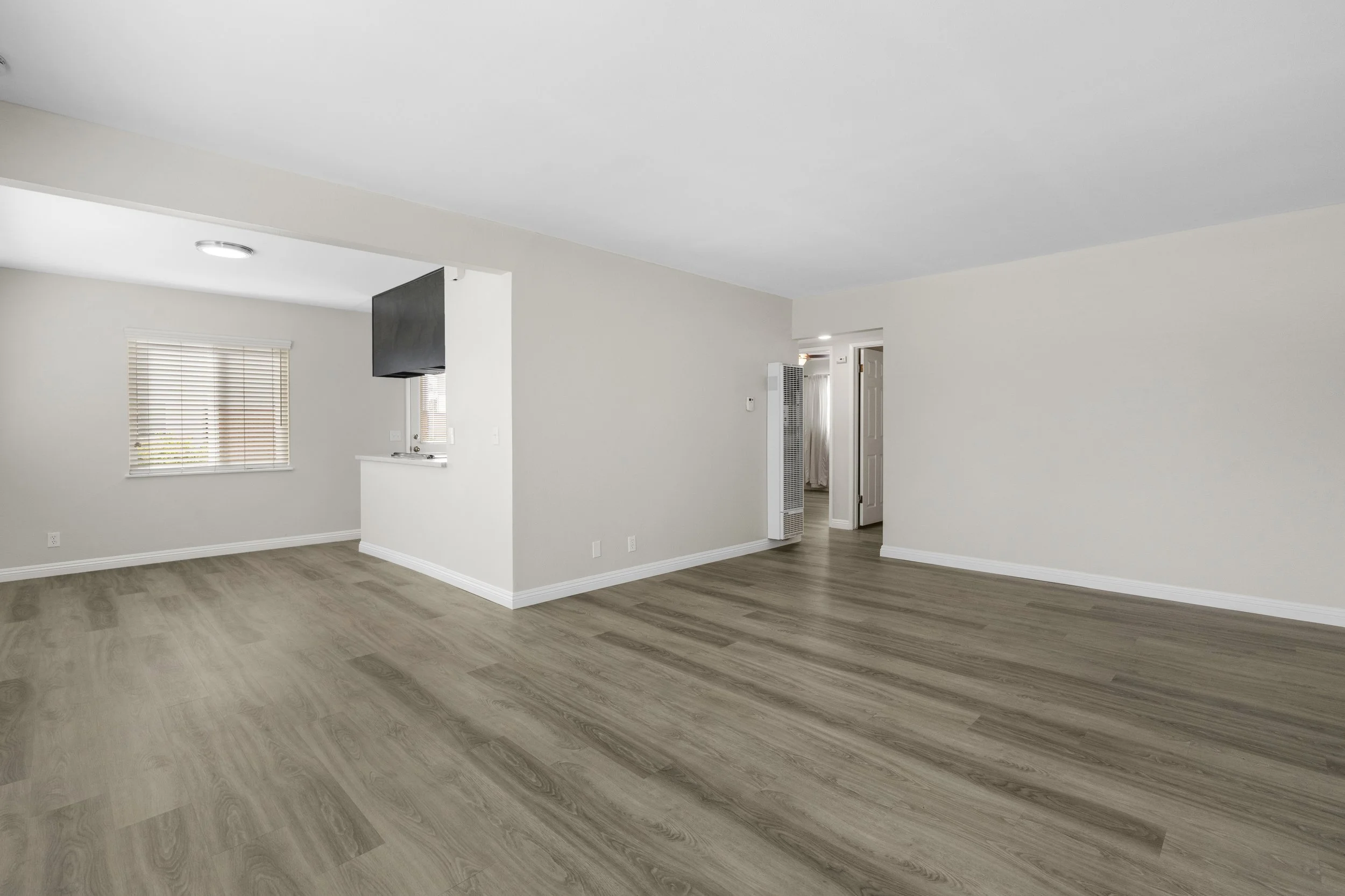 Real estate photography, virtual staging family room before