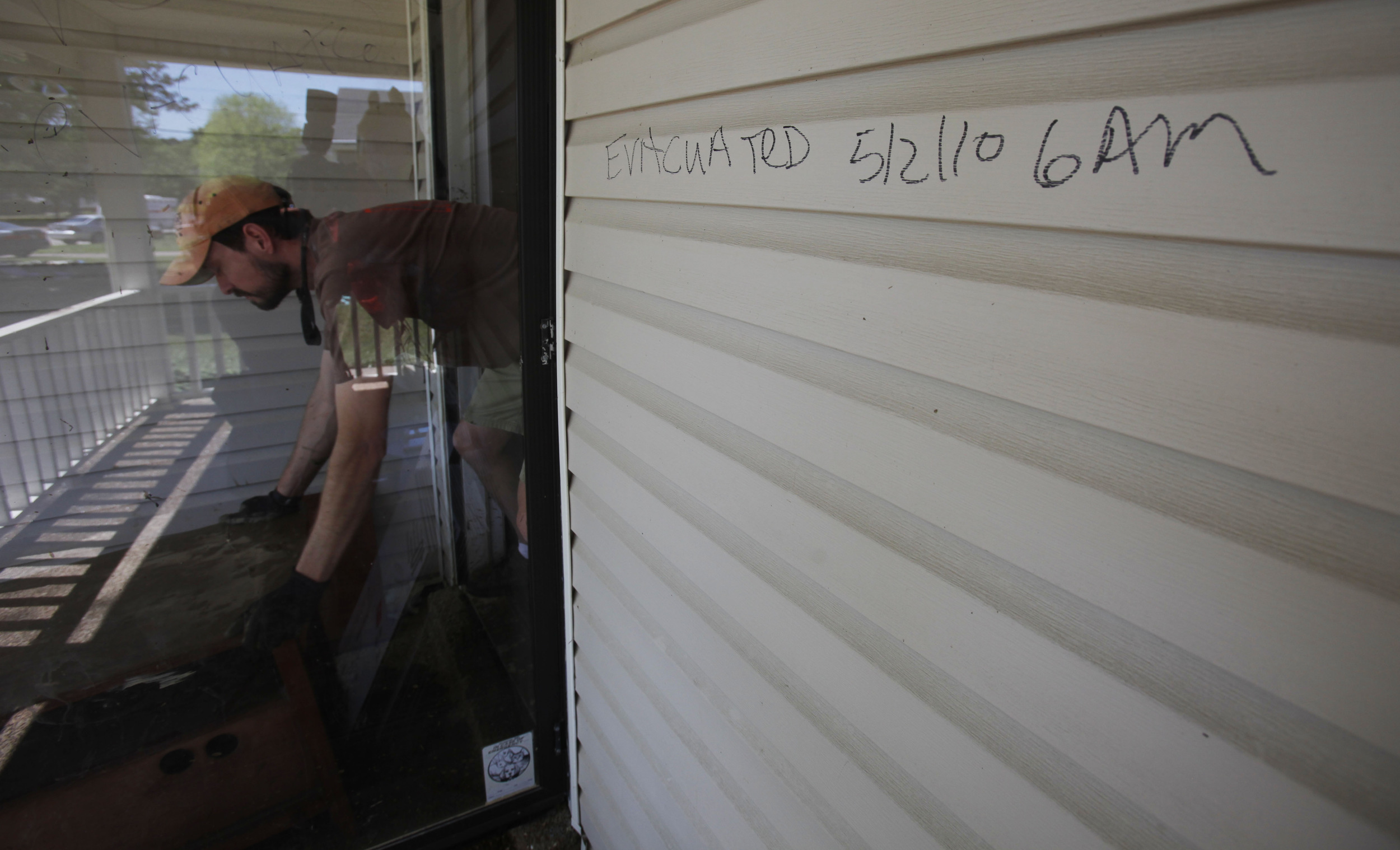  A doorway marked with evacuation notes as cleanup and recovery get started May 4, 2010 in the Bellevue area. 
