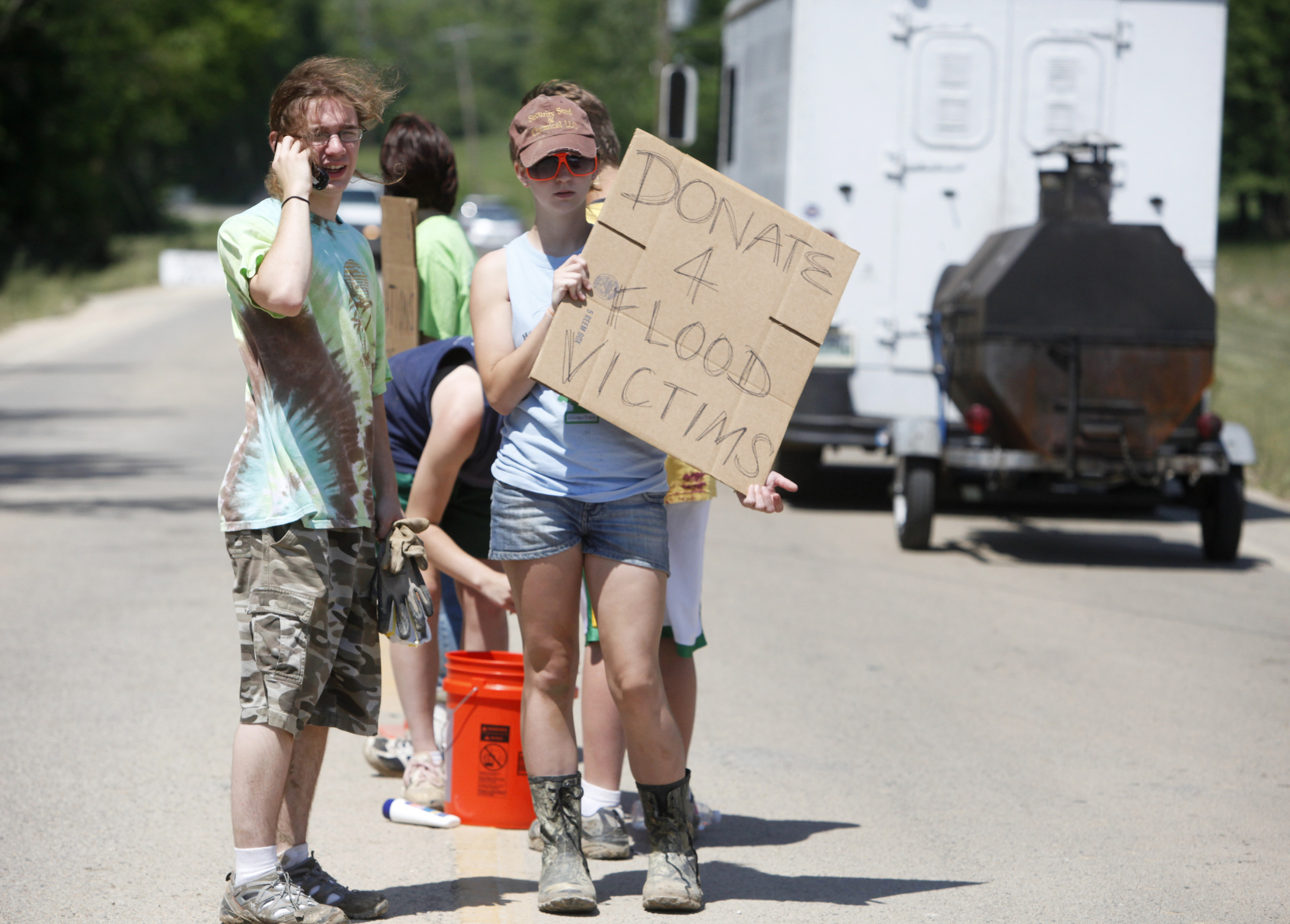  Students from Harpeth Middle School and High School stand in the middle of highway 70 soliciting donations for flood victims May 7, 2010 in Shacklett, Tenn. 