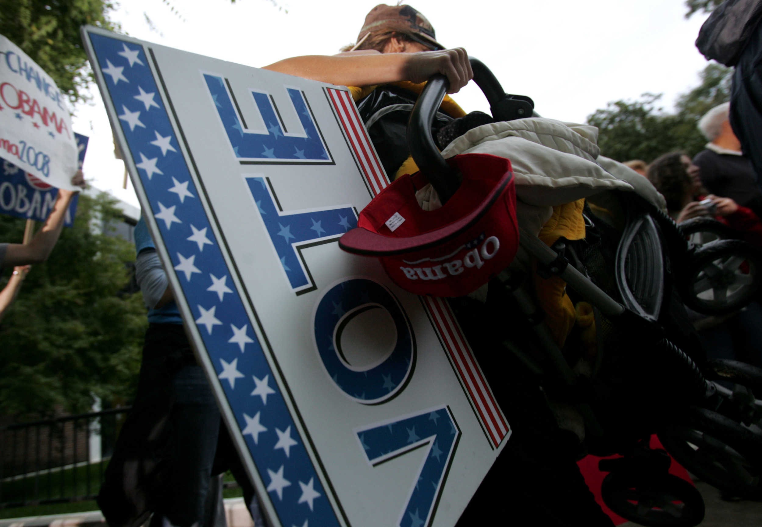  An Obama supporter carries a sign on entering the quad before the debate at Belmont University in Nashville, Tenn. 