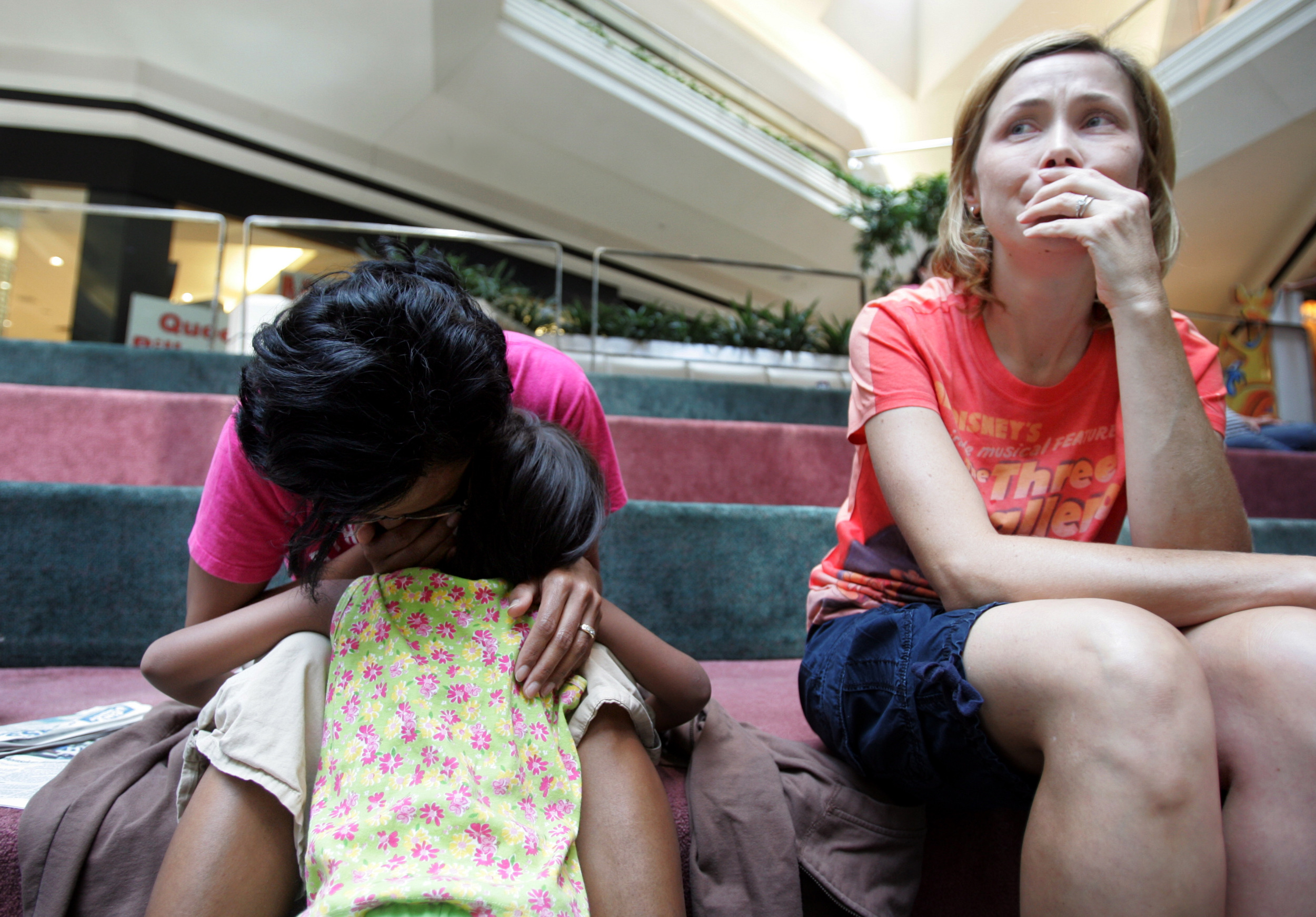  Melinda Sutton, a volunteer host for Kajal, cries as Karthi Masters meets with Kajal in a Nashville mall to tell her that she will not be able to adopt her August 7, 2007. The adoption fell apart due to conflicts between the Masters family and her g