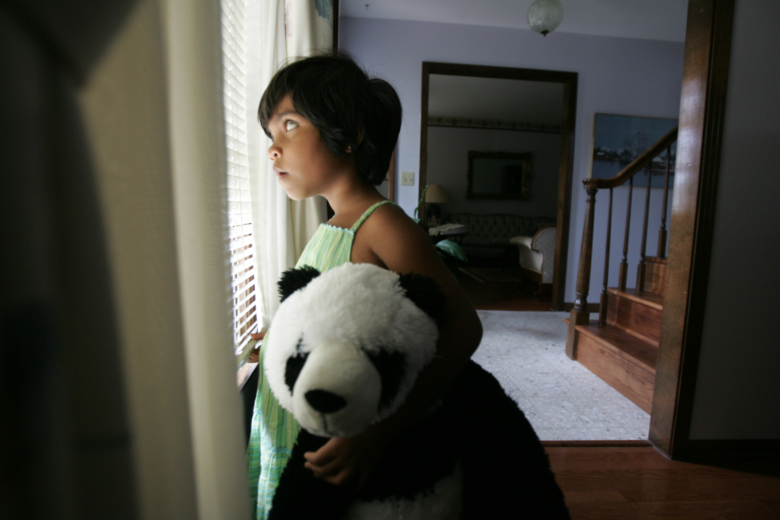  Kajal stands in front of a window at a second host family's house in Bellevue September 13, 2007. Her future uncertain, Kajal's journey in the U.S. has been fraught with complications and heartbreak.  