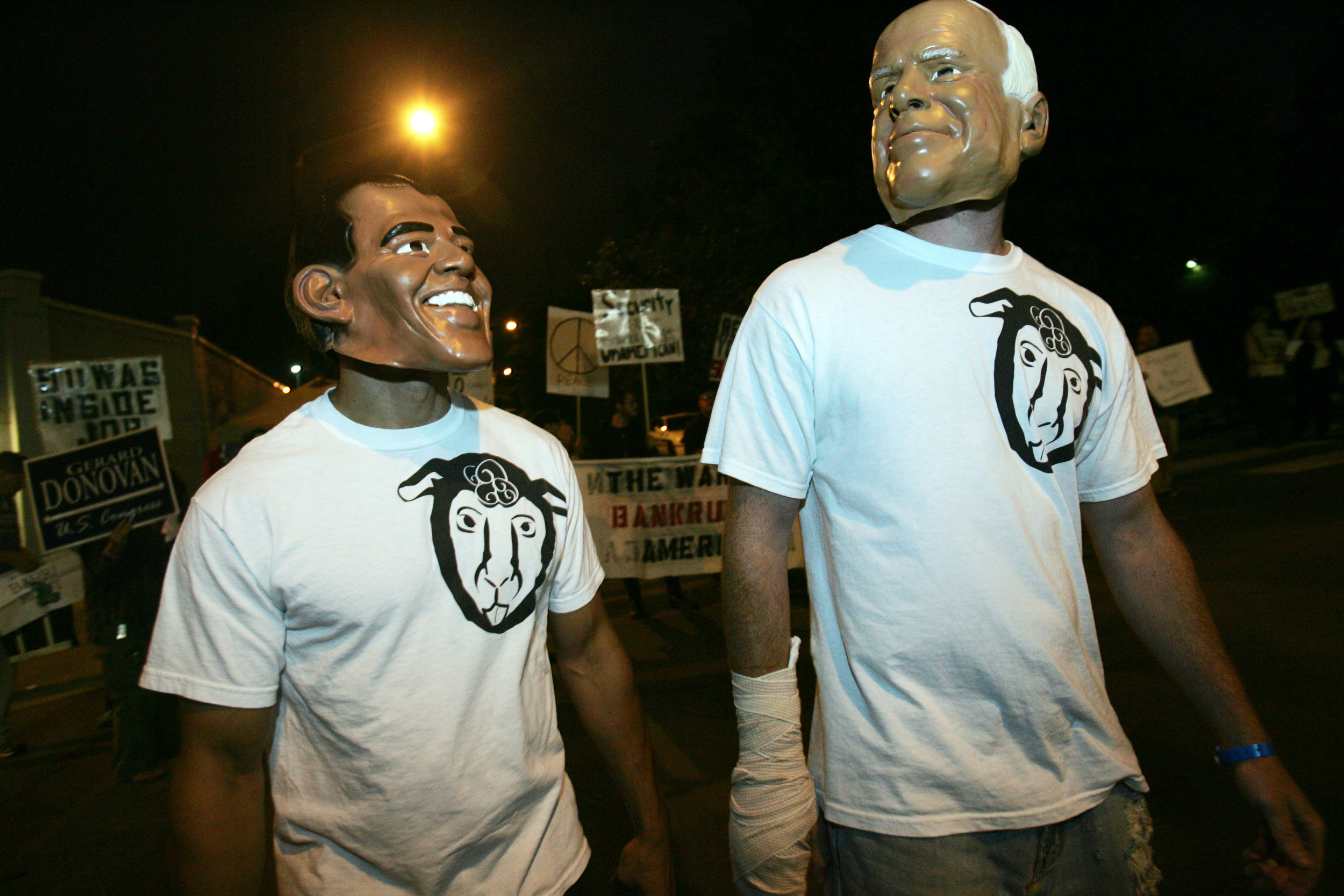  A group protesting the lack of third party candidates wears Obama and McCain masks outside the town hall debate. 