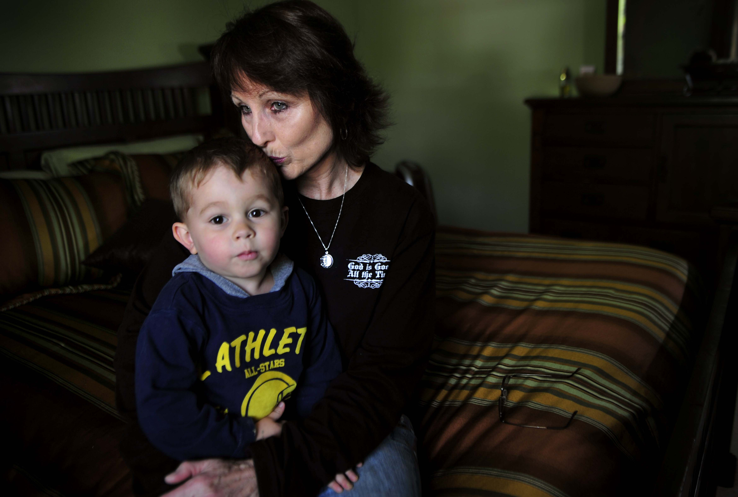  Sherry Wilson, sits in her son Danny Tomlinson's room with Tomlinson's nephew, age 3, April 21, 2011 in Pegram, Tenn. Tomlinson died while driving during the 2010 flood. Wilson and her husband moved into her son’s house and have kept his bedroom a s