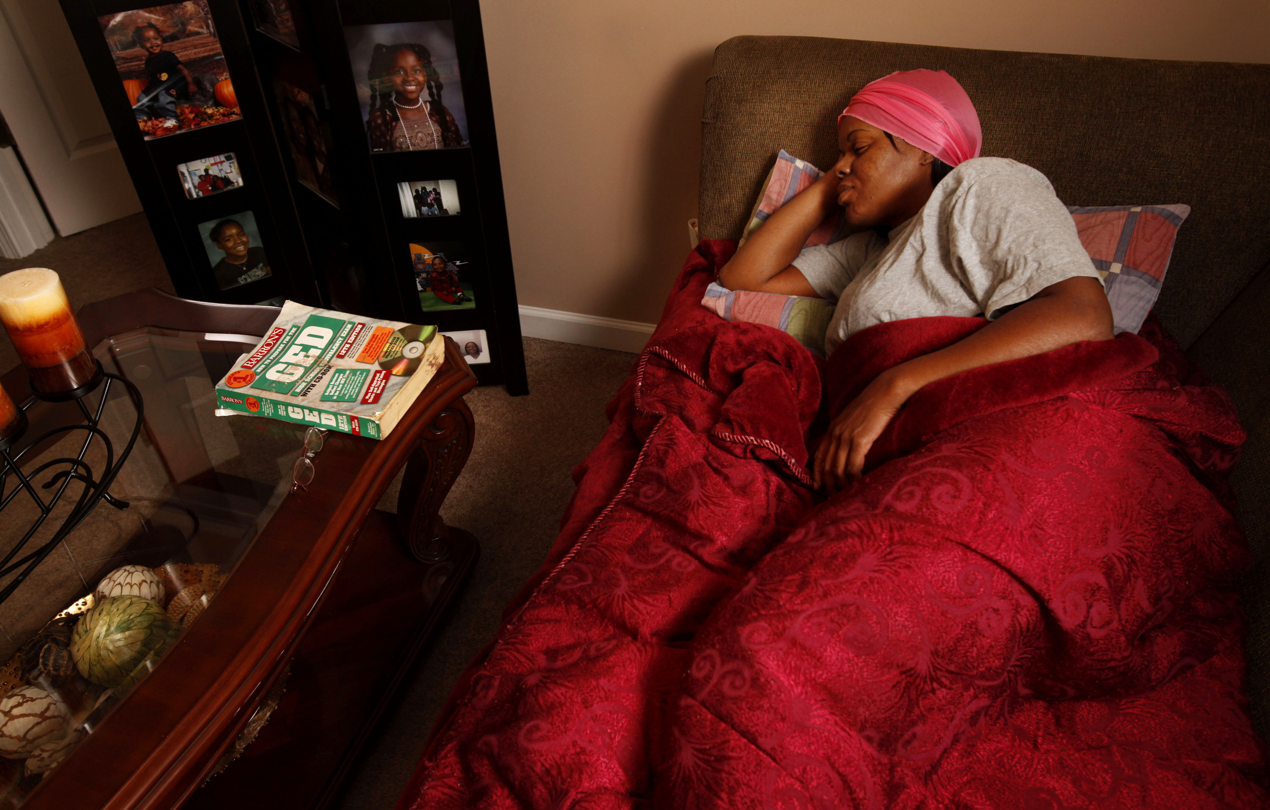  Sherry Moore goes to bed on the living room couch at her daughter's house six months after the May flood September 9, 2010, in Nashville, Tenn. Moore went from getting her GED on May 1- she had a house, job and promising outlook - to disaster on May