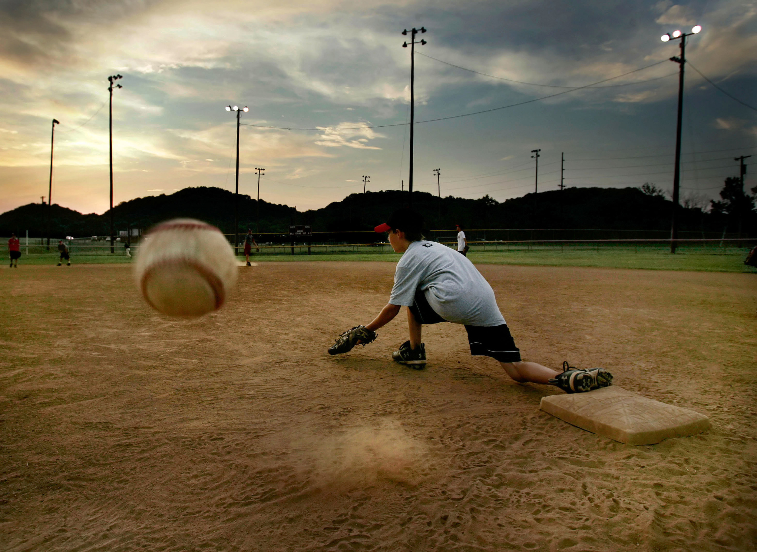  The WNSL Backyard Brawlers' first baseman Evan Forrest misses the ball thrown from second during evening practice at Warner Park June 24, 2008 in Nashville, Tenn.  