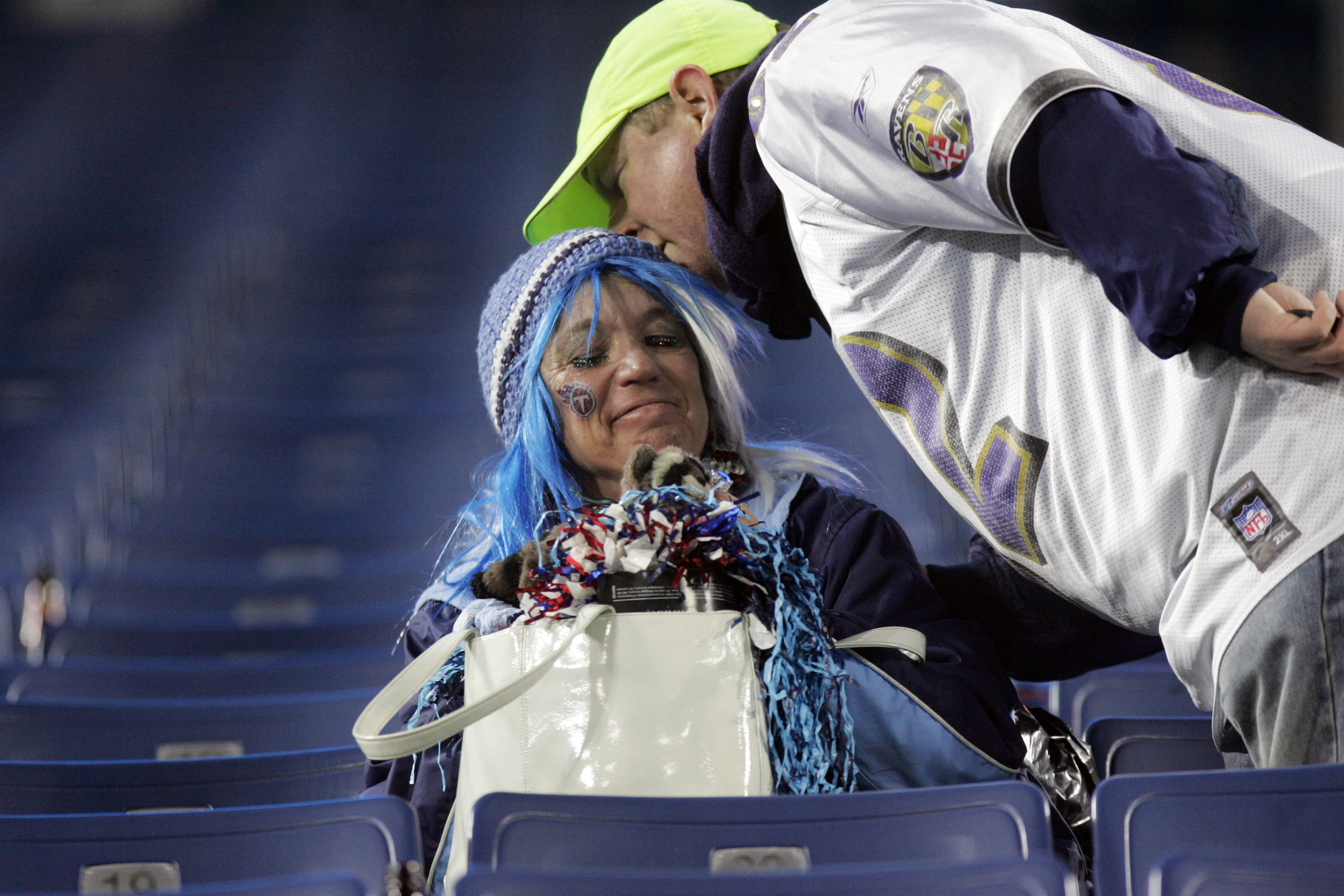  Titans fan Helen Locke gets a consolation kiss from a Ravens fan as she sat depressed in the stands after the Ravens defeated the Titans in the playoffs, smashing hopes of a Titans Superbowl at LP Field Saturday, January 10, 2009 in Nashville, Tenn.