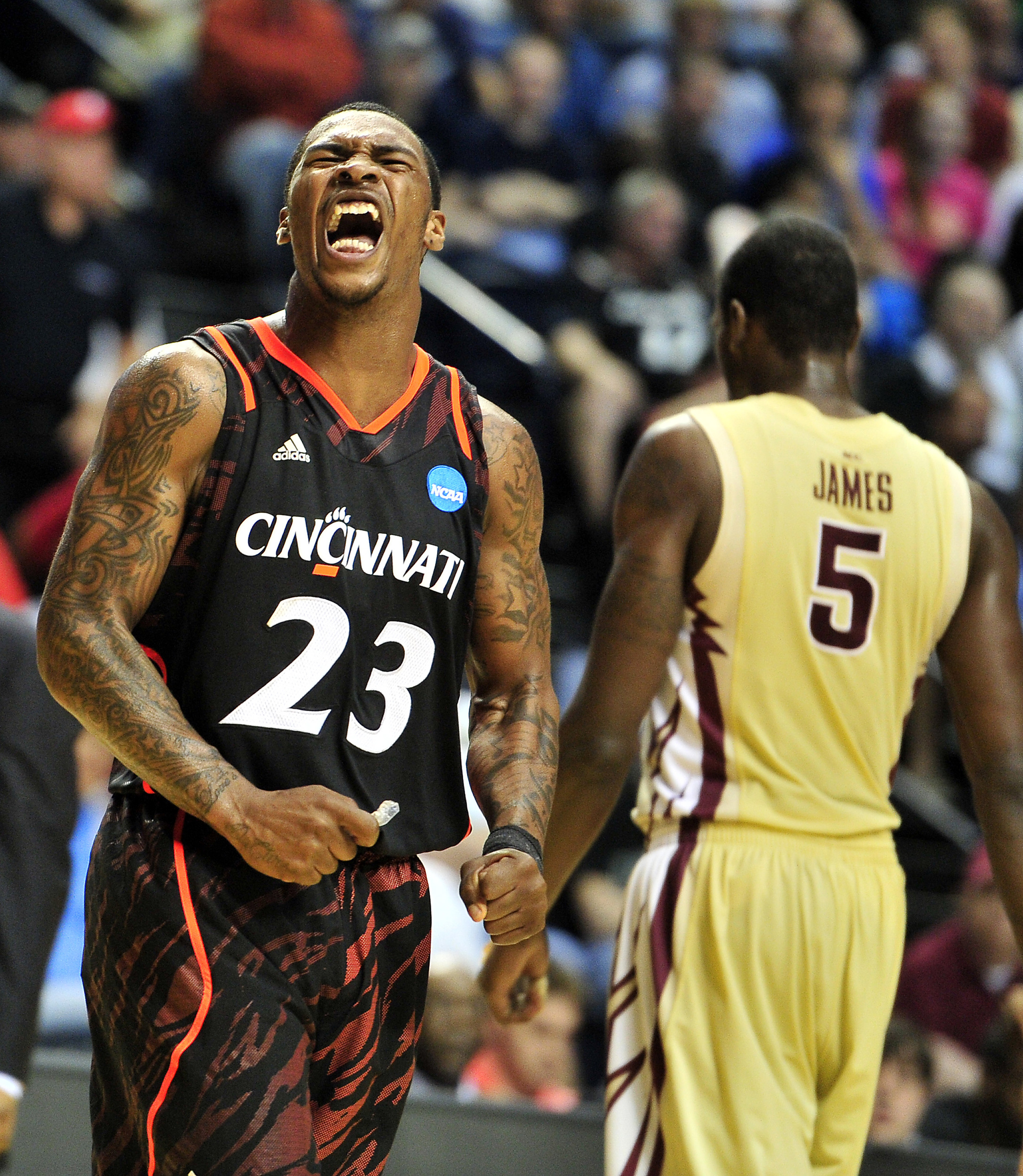  Cincinnati guard Sean Kilpatrick (23) reacts as Florida State forward Bernard James (5) walks back to the bench during the second half of Cincinnati’s 62-56 win in the NCAA Men's Third Rounds at Bridgestone Arena Sunday, March 18, 2012 in Nashville,