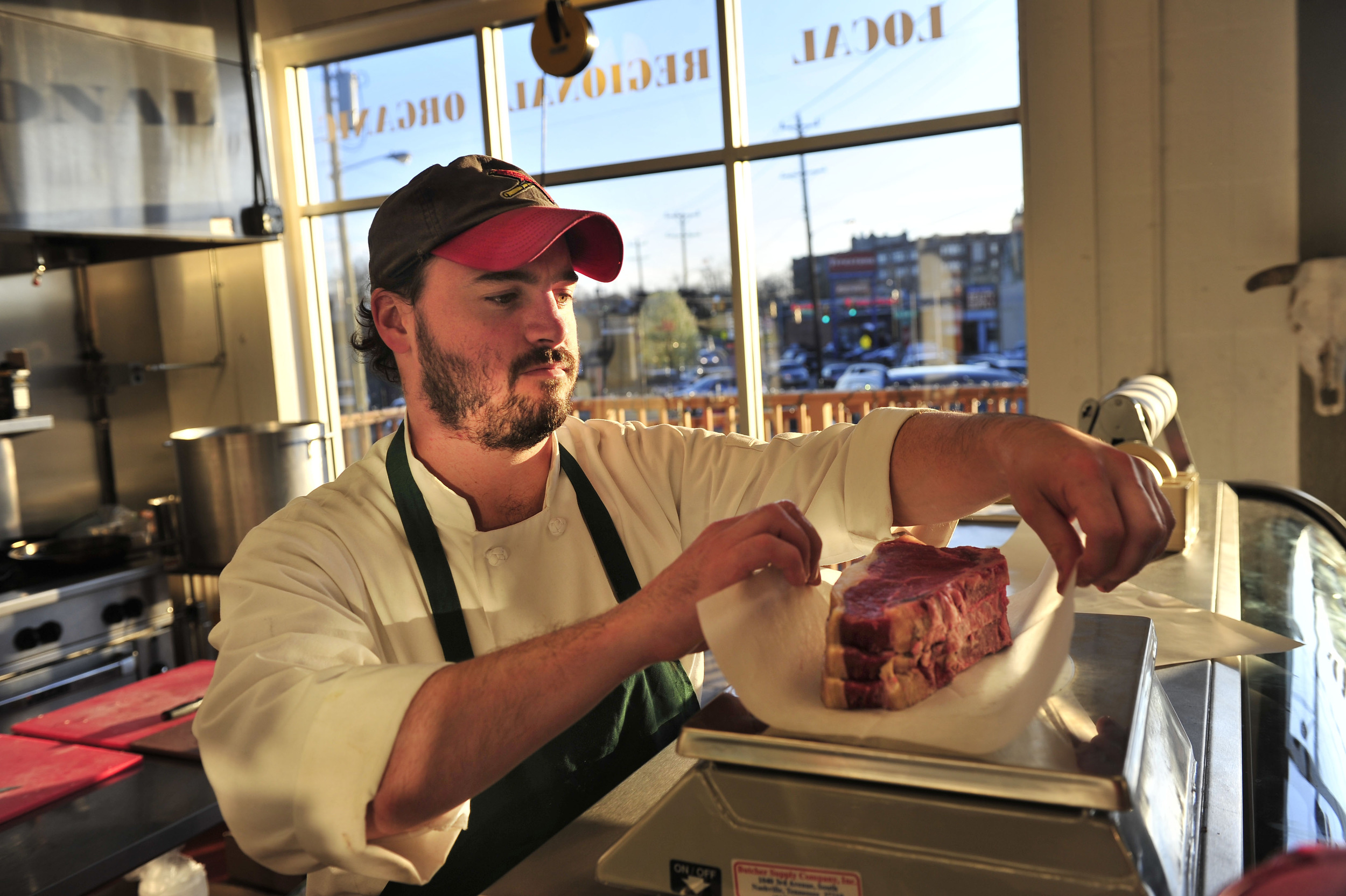  Co-founder James Peisker weighs freshly cut steaks at Porter Road Butcher in Nashville, Tenn. 