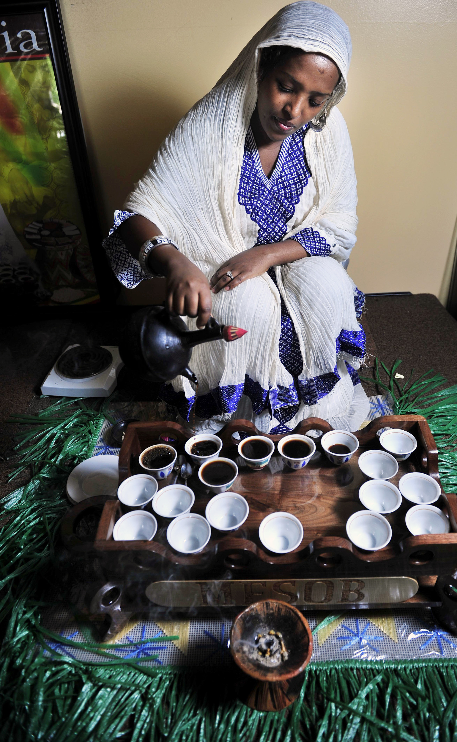  Hiwot Shafi pours out ethiopian coffee in a traditional coffee ceremony at Mesob Ethiopian Restaurant in Nashville, Tenn. 