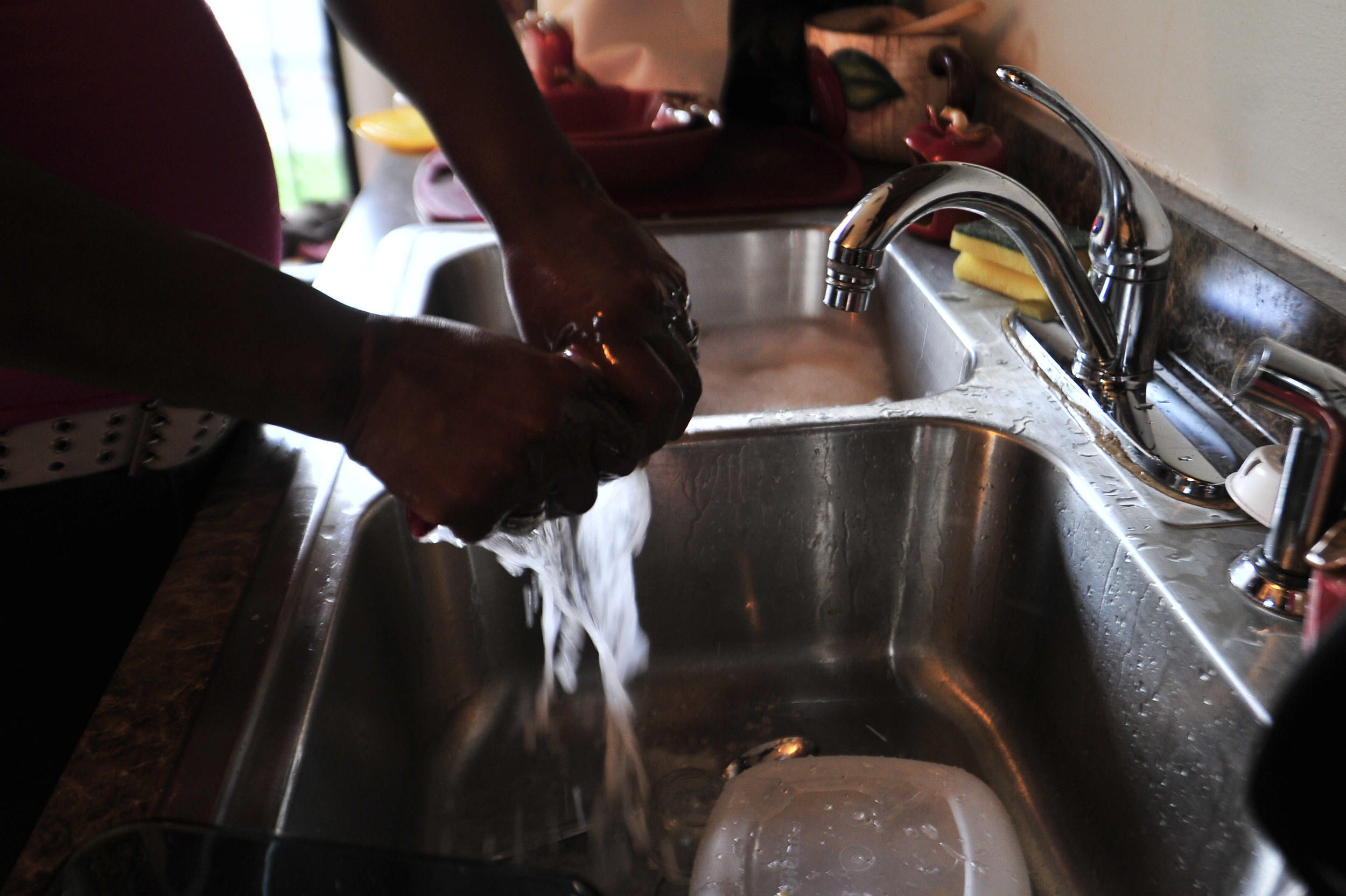  Sylvia Nolan cleans her house from top to bottom each evening after work May 16, 2013. 