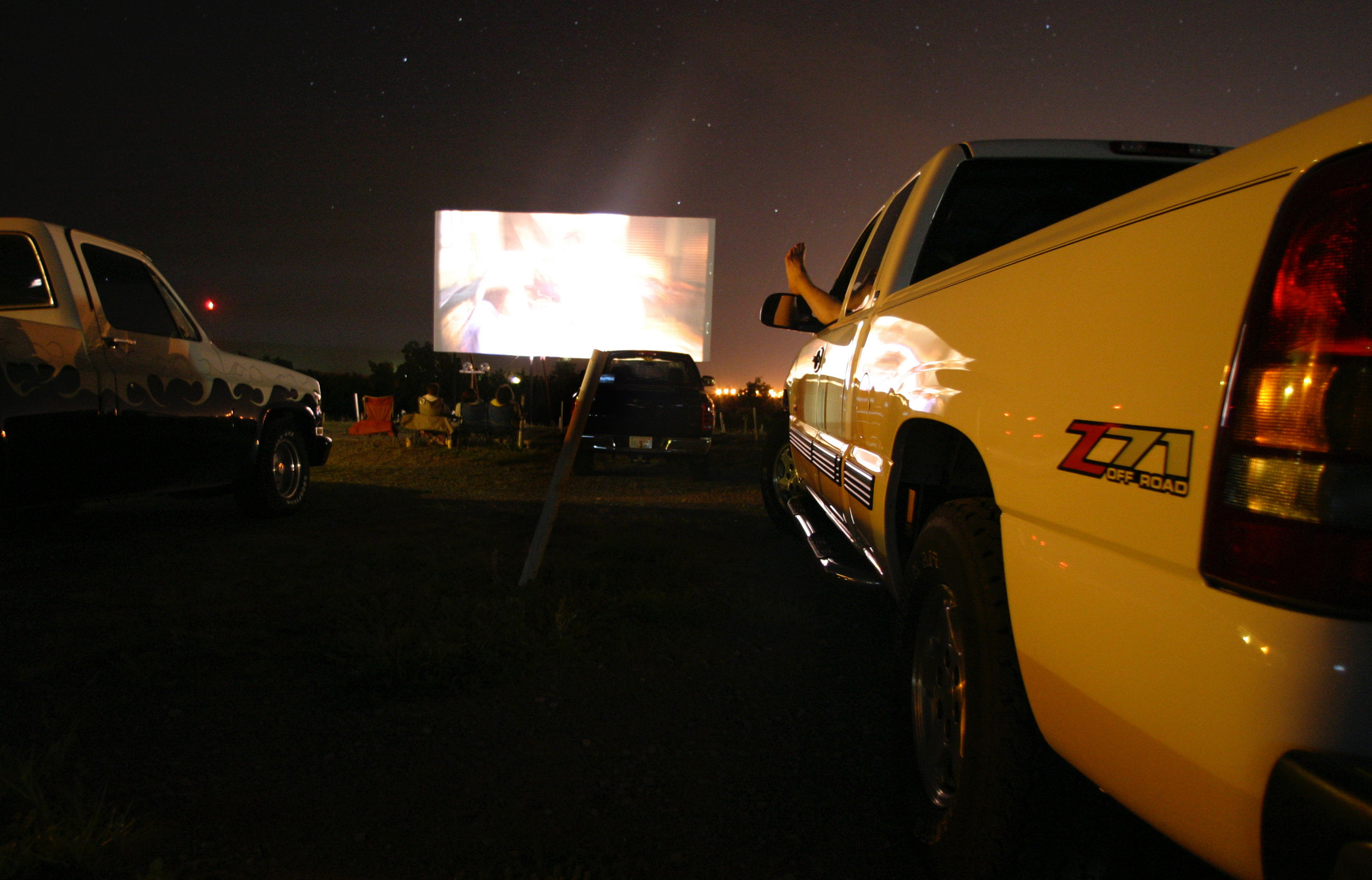  A foot sticks out of the window at the crowded drive-in theater in Weatherford, Oklahoma.  