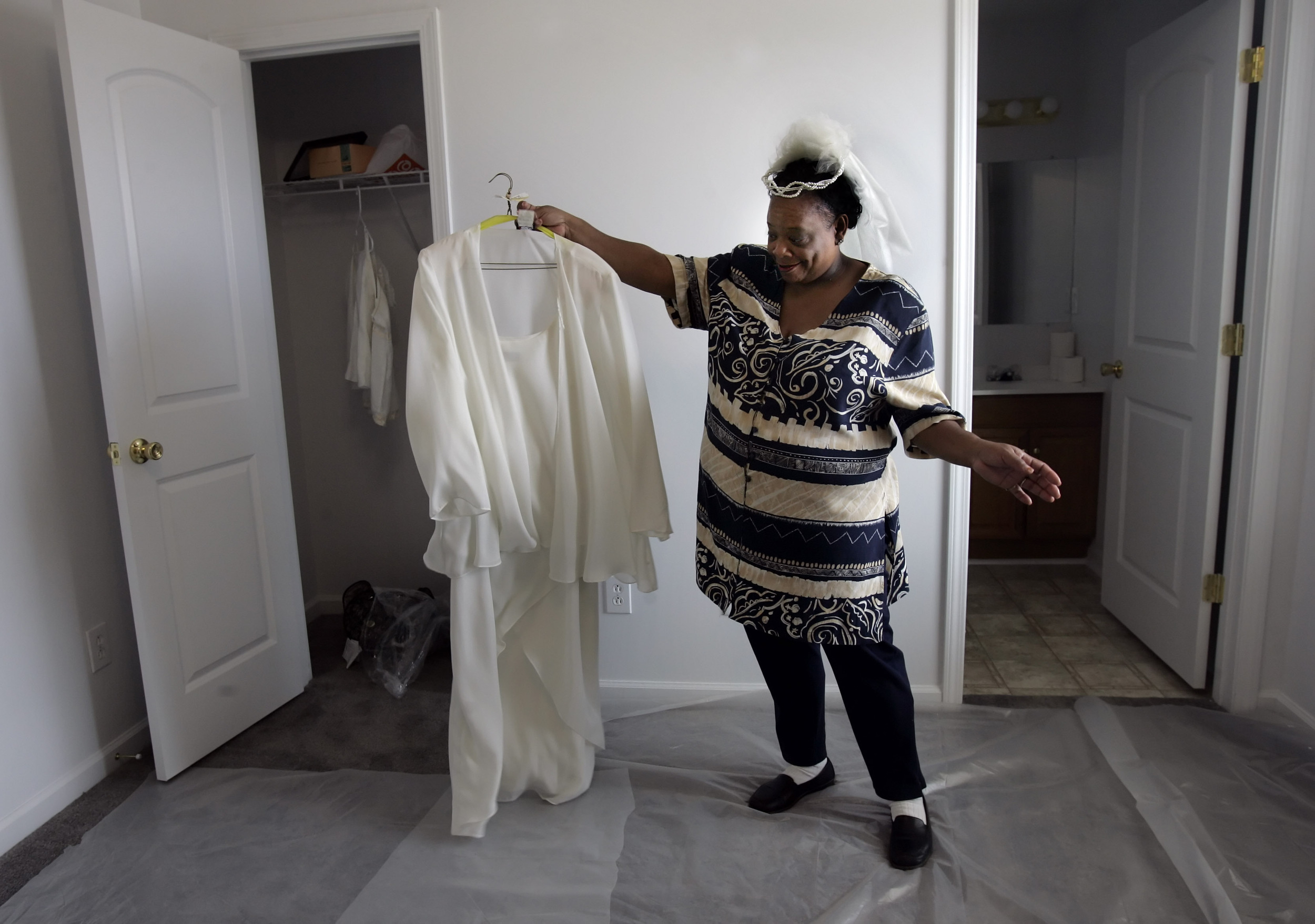  Phyllis Palmer shows off her wedding dress in her new habitat house  in Nashville, Tenn. Palmer and George Shaw, who was displaced by Katrina, will be married Sunday afternoon at the Habitat for Humanity's Timberwood subdivision site. 