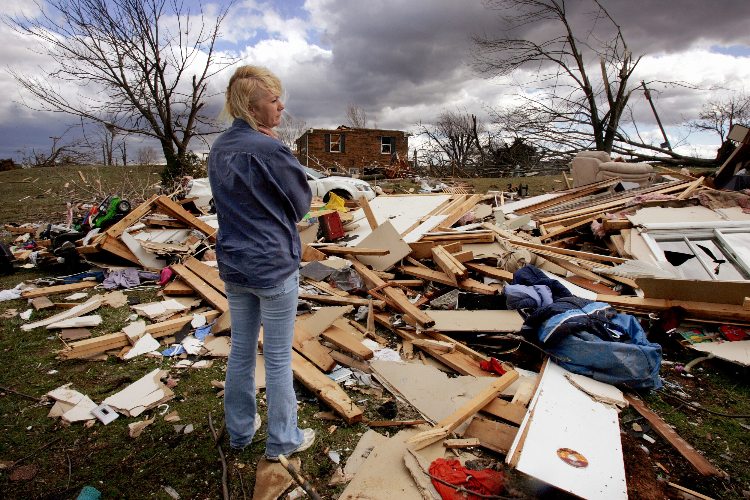  Sherry Givens stands in the wreckage of a tornado touchdown February 8 2008 in Lafayette, Tenn. 