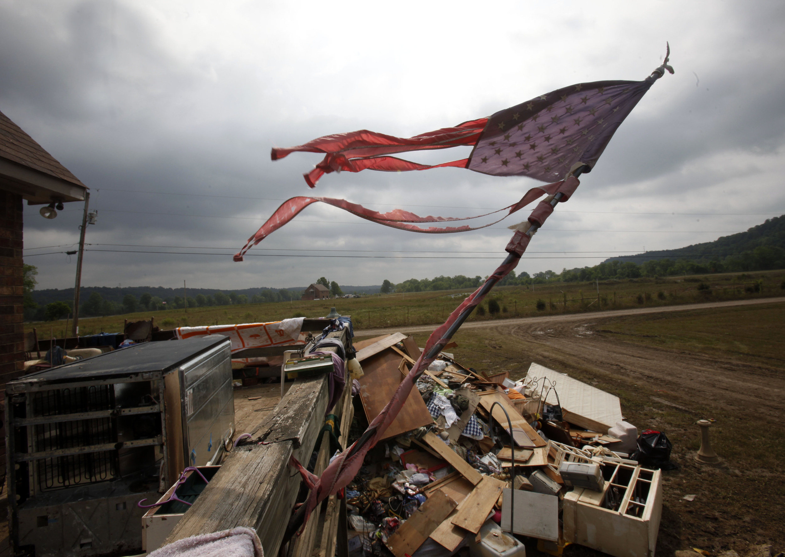  A flag is in tatters amidst wreckage after the historic 2010 flood inundated this floodplain along the Cumberland near Ashland City Wednesday, May 12, 2010 in Cheatham County, Tenn. 