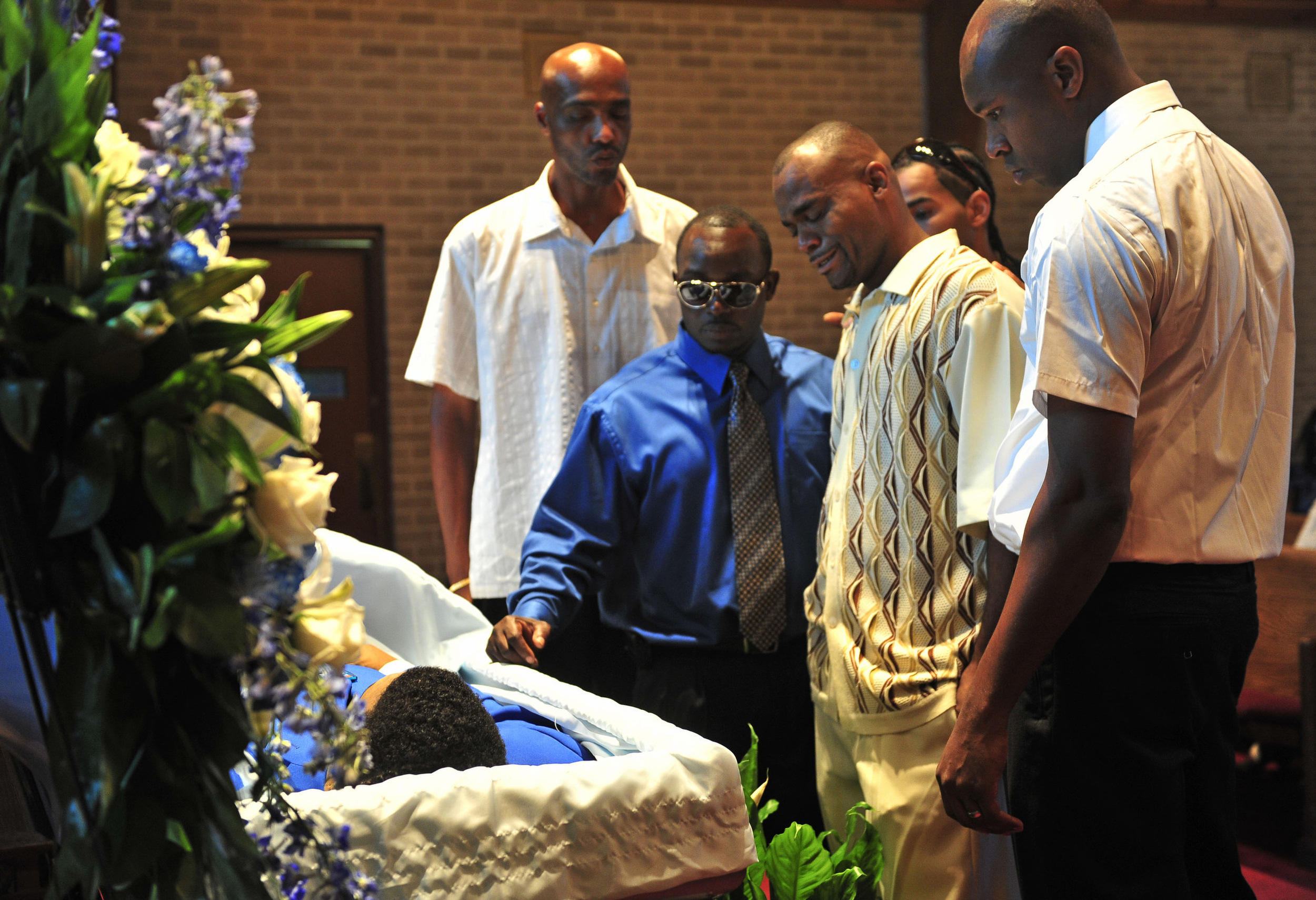  Mourners at the casket of murder victim Larry E. King during his memorial service August 27, 2011 in Nashville, Tenn. King’s killer was out of prison on early release parole.  