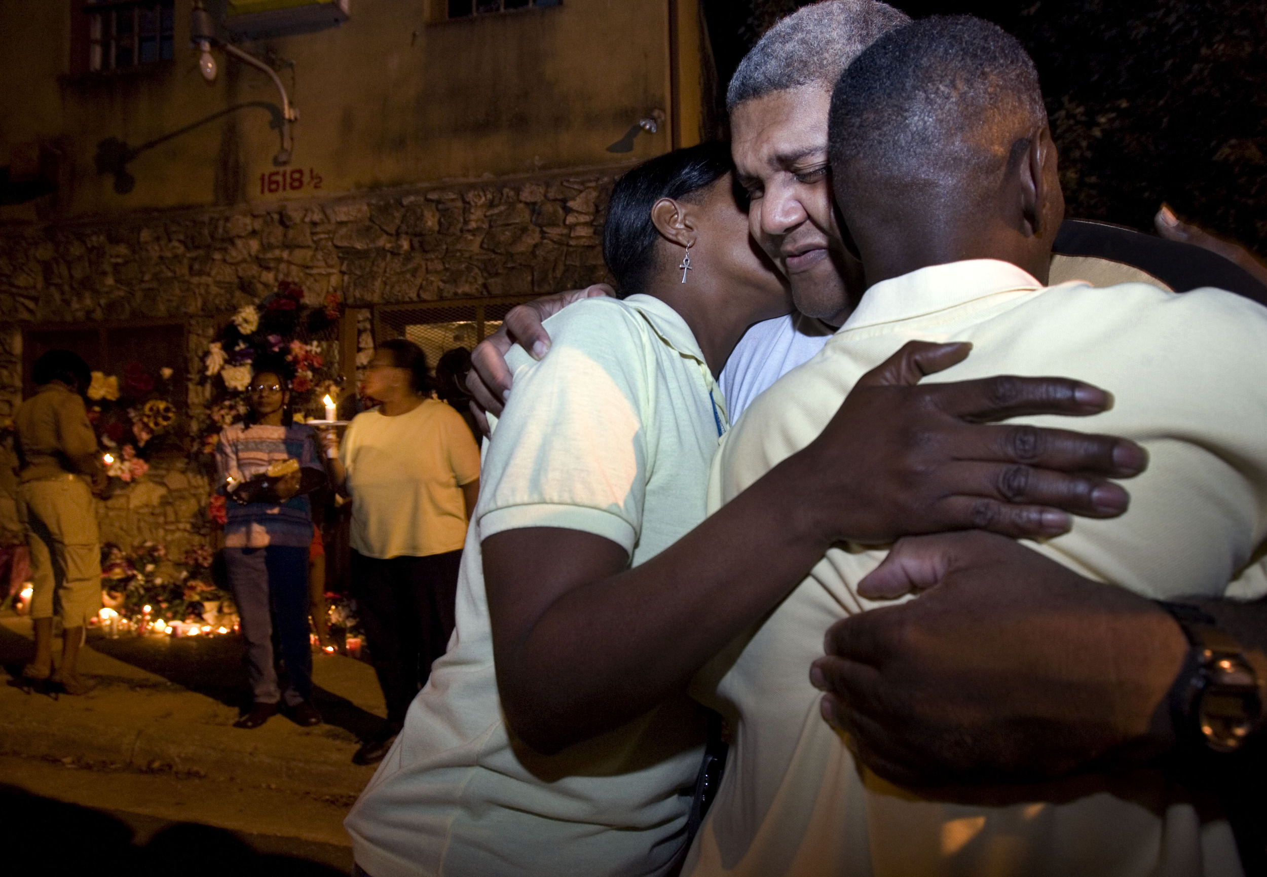  Ronald Wilson gets a hug in front of Cahal Market during a candlelight vigil for his mother Tuesday, October 9, 2007 in Nashville, Tenn. Classy Wilson, 70, a well-loved local and clerk at the market, was shot and killed by a middle schooler. 