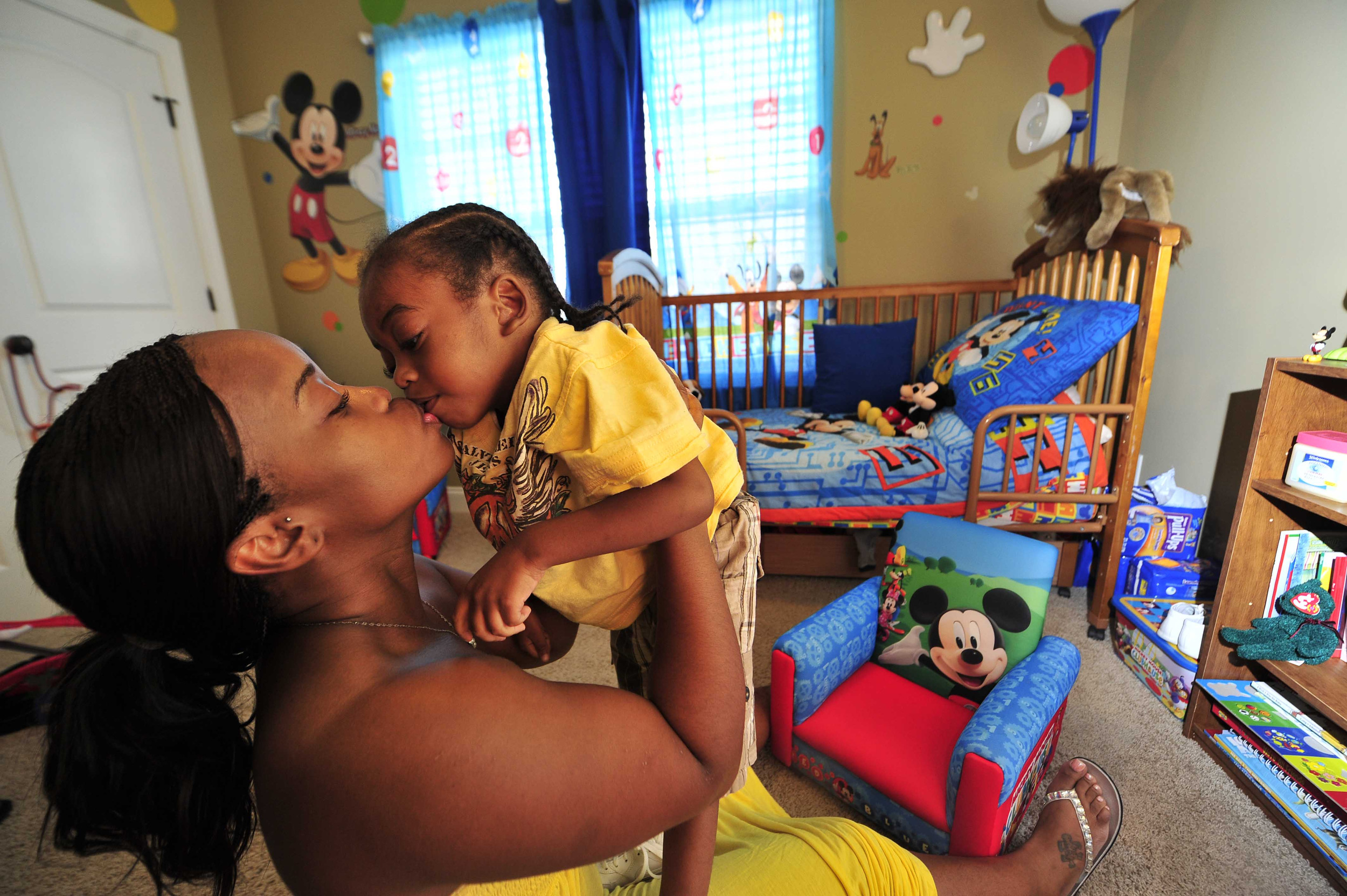  LaKesha Welch kisses son Darian Jones, 4, in his Mickey Mouse themed bedroom at home July 20, 2011 in Nashville, Tenn. Her son has suffered from an unknown diseases since he was one years old that is robbing him of motor skills and speech.  