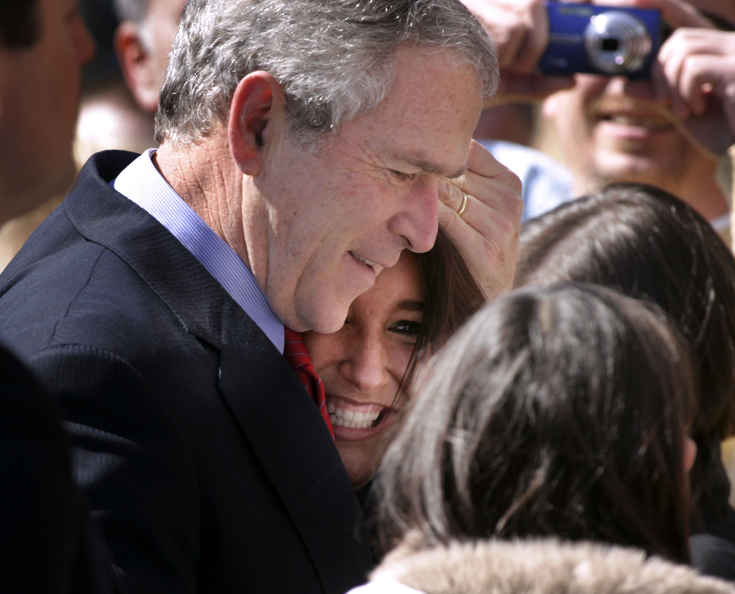  President George W. Bush hugs Courtney Harris of Lebanon before boarding Airforce One to depart Nashville  Tuesday, March 11, 2008 in Nashville, Tenn. 