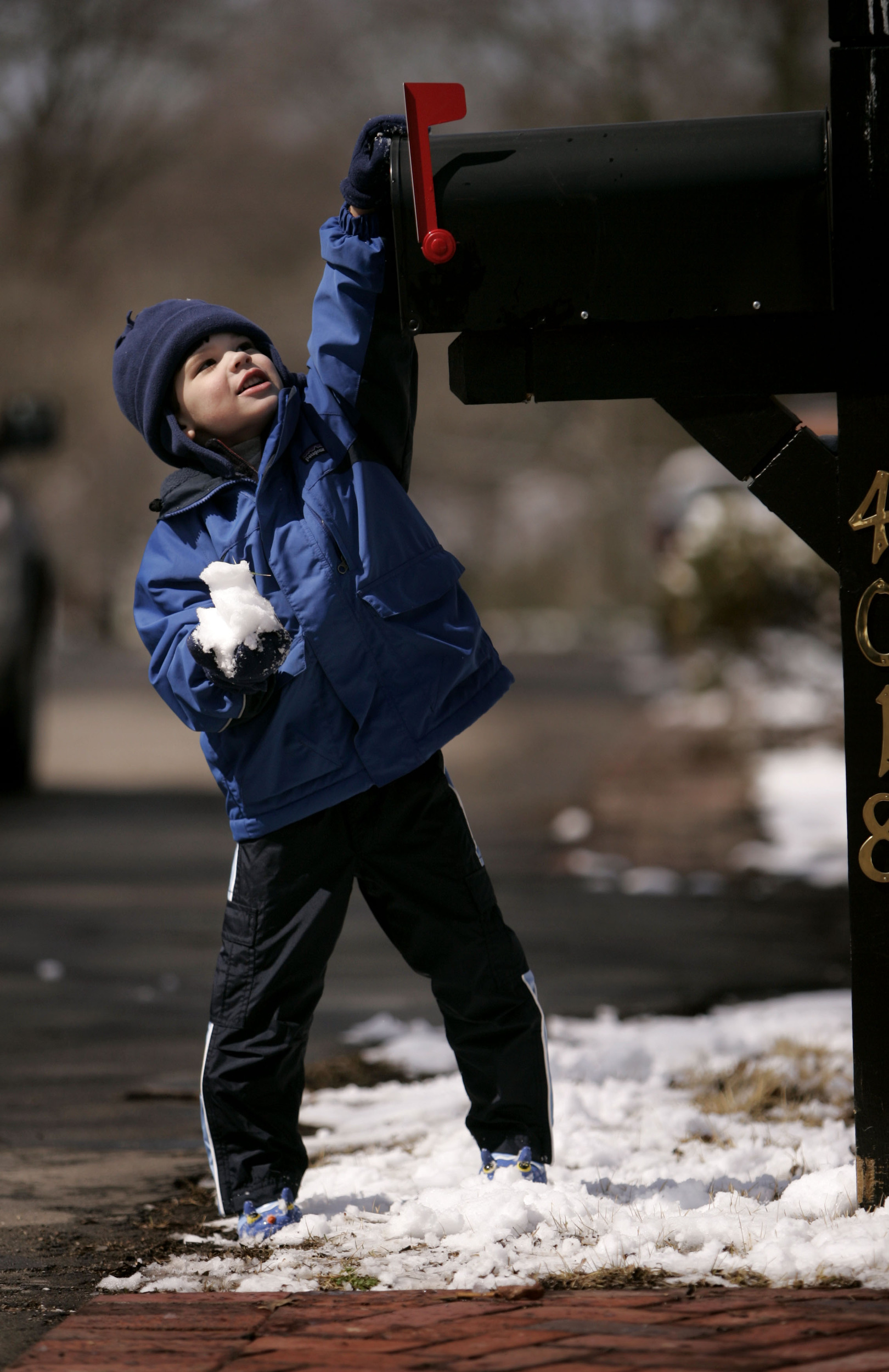  Chase Fields, 3, puts a snowball in a mailbox Saturday morning as several inches of snowfall began melting quickly Saturday, March 8, 2008 in Nashville, Tenn.  