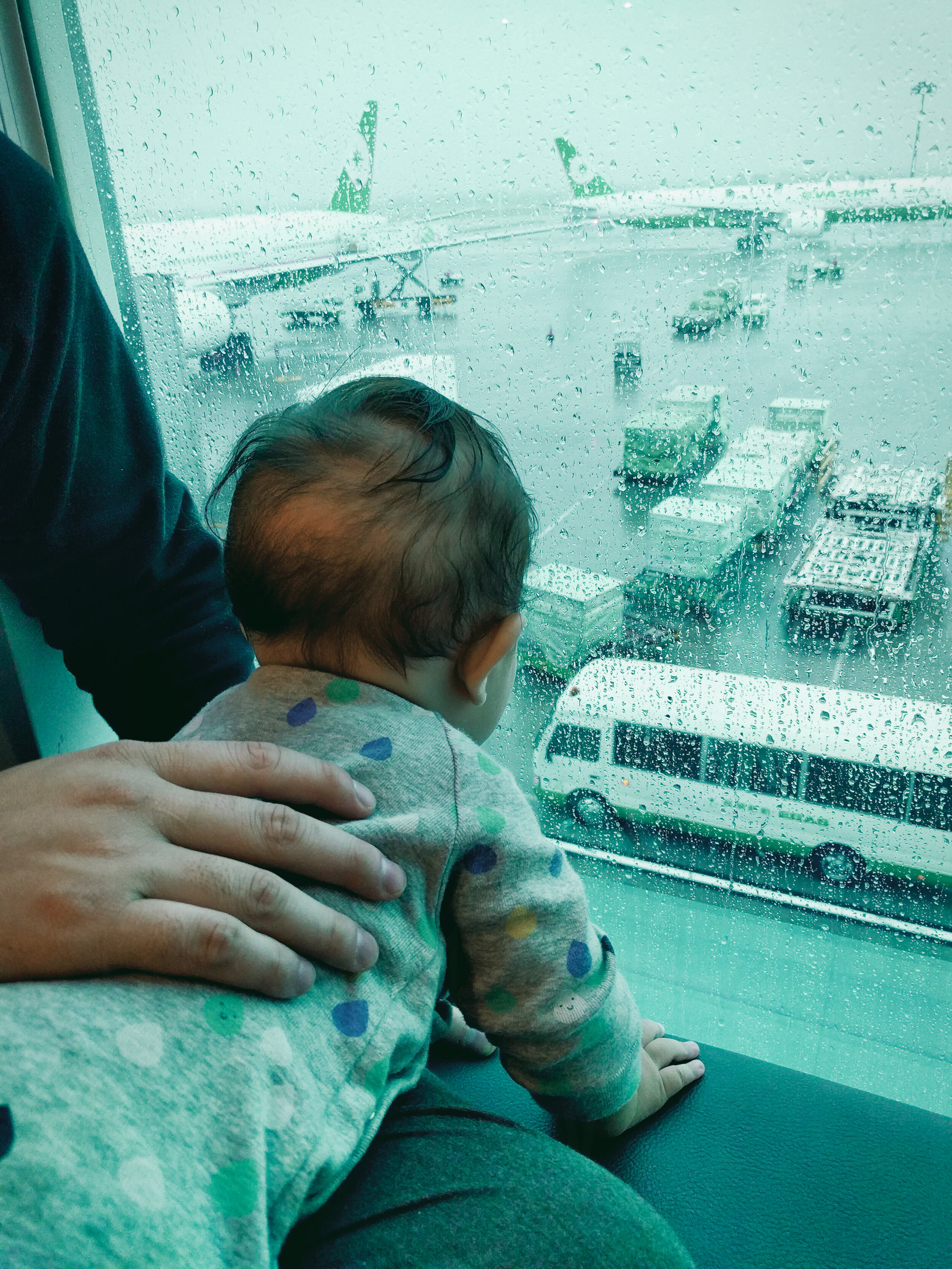  Elden (7 months old) watching the planes and ground crew 