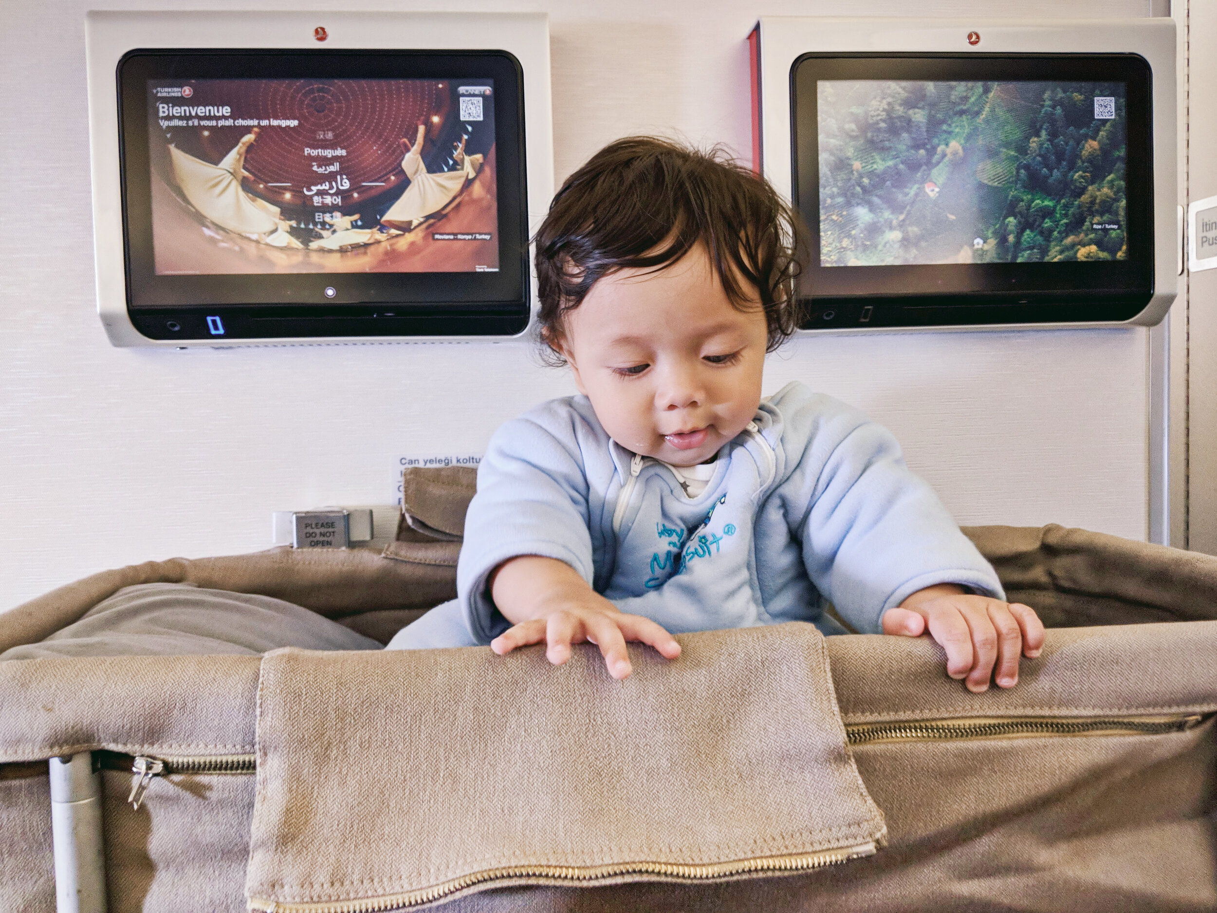  Orlo (6 months old) sitting in his baby bassinet on Turkish Airlines 