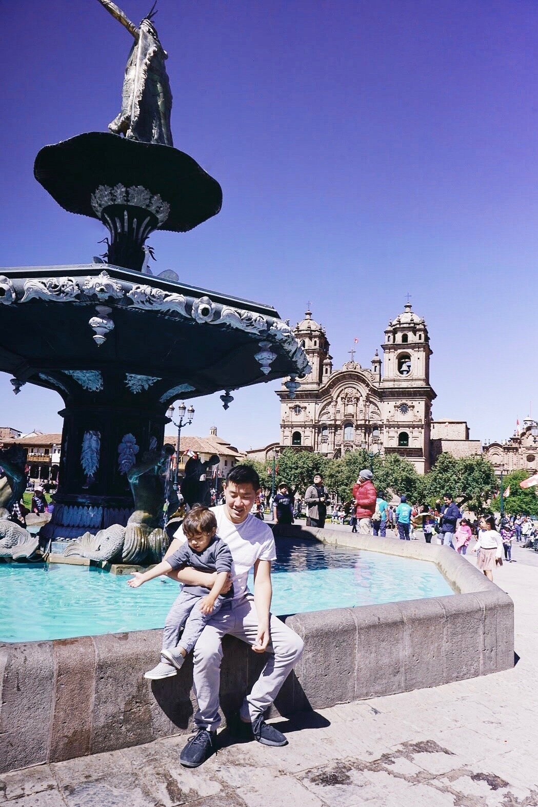 Elden (2.5 years old) playing with Peruvian toddlers in the water fountain in Plaza de Armas