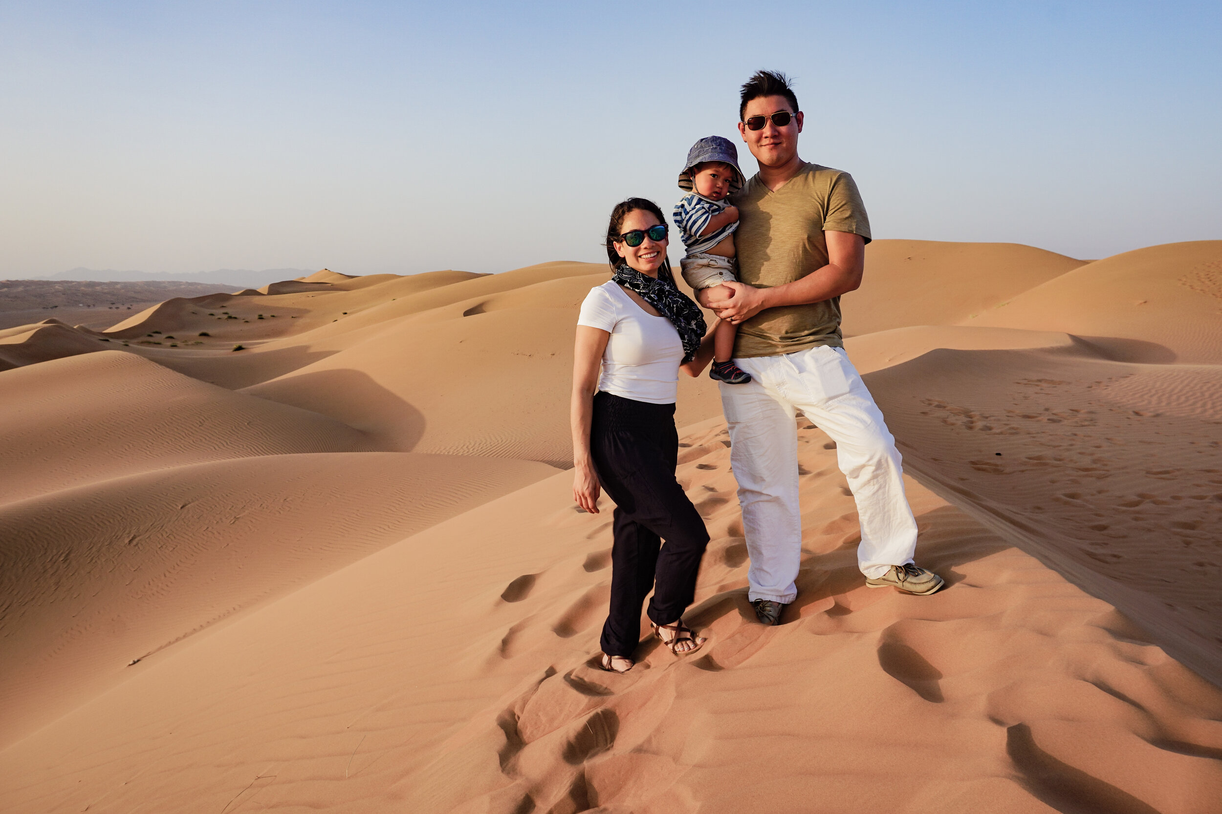 Traveling-mixed-family-with-baby-Oman-Wahiba-Sands-desert-dunes.jpg