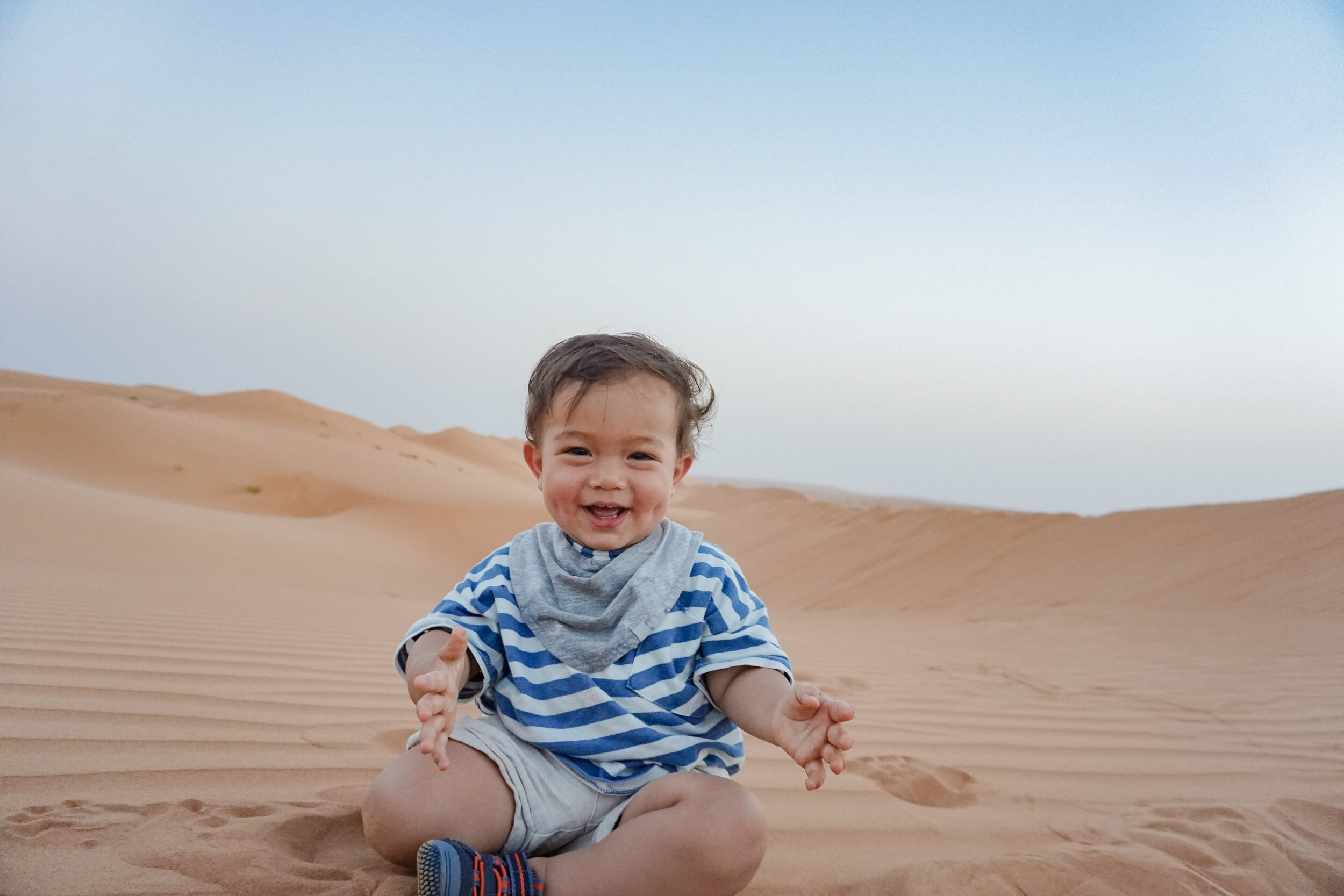 Baby-half-asian-Oman-Wahiba-Sands-desert-dunes.jpg