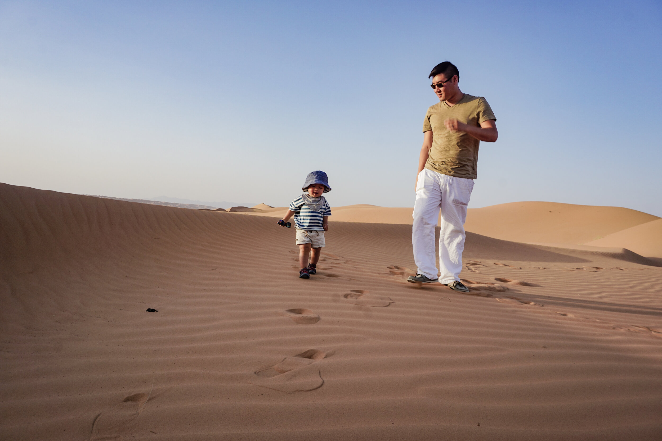 Wahiba Sands desert dunes toddler walking