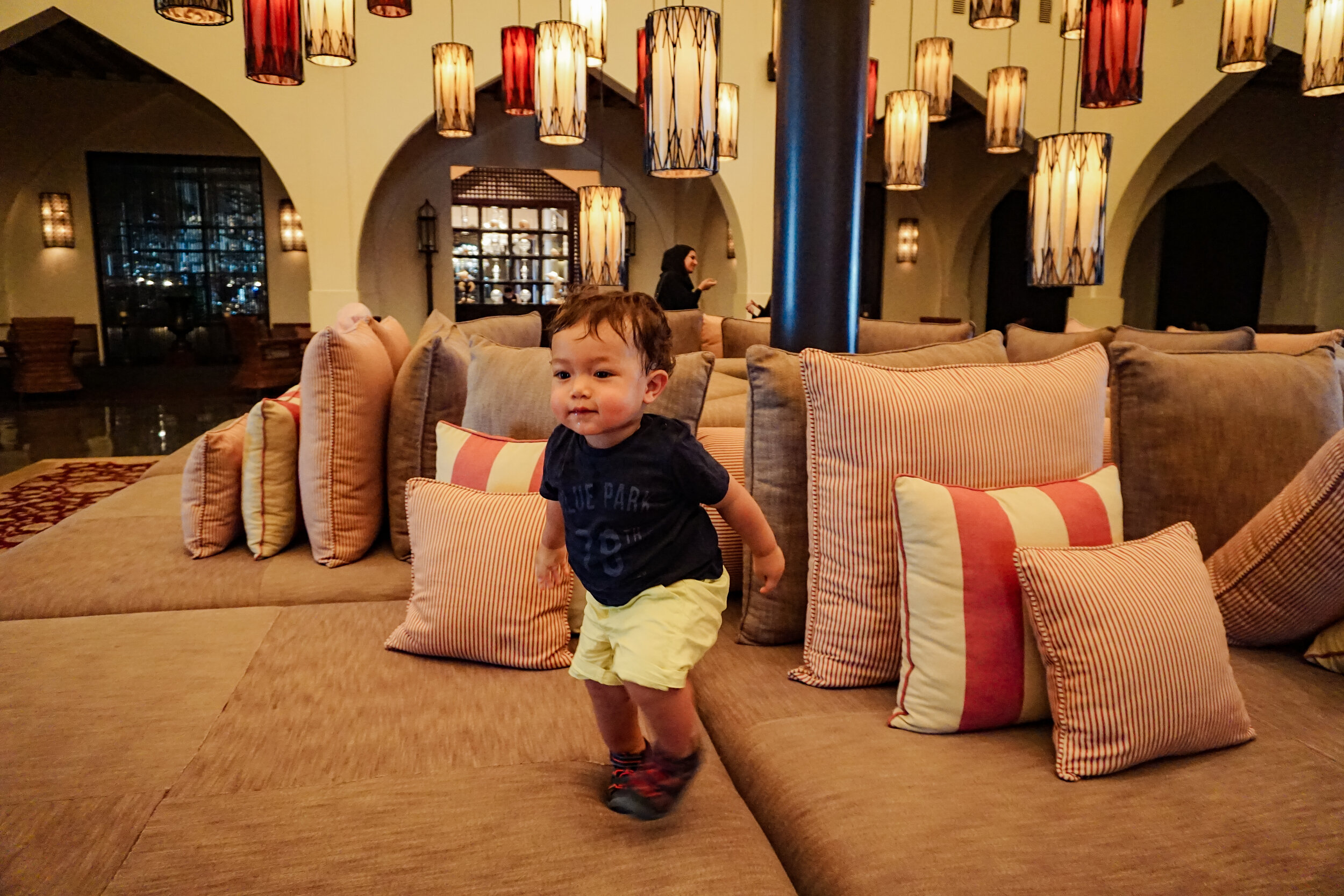 Baby-toddler-playing-couch-lobby-The-Chedi-Muscat-Oman.jpg
