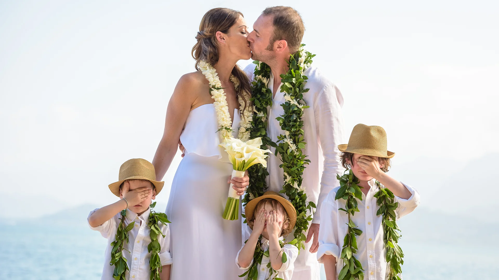 An intimate destination wedding at Kualoa Ranch Secret Island, Hawaii.