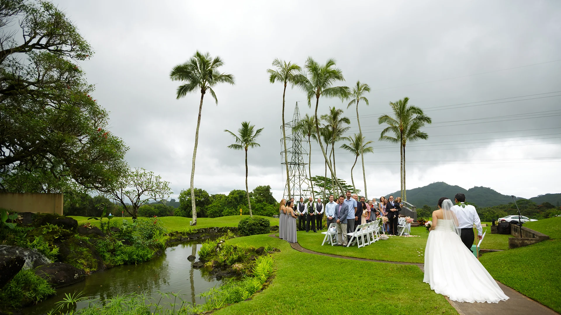 Father walking his daughter down the aisle at Koolau Ballrooms Outdoor Garden in Hawaii.