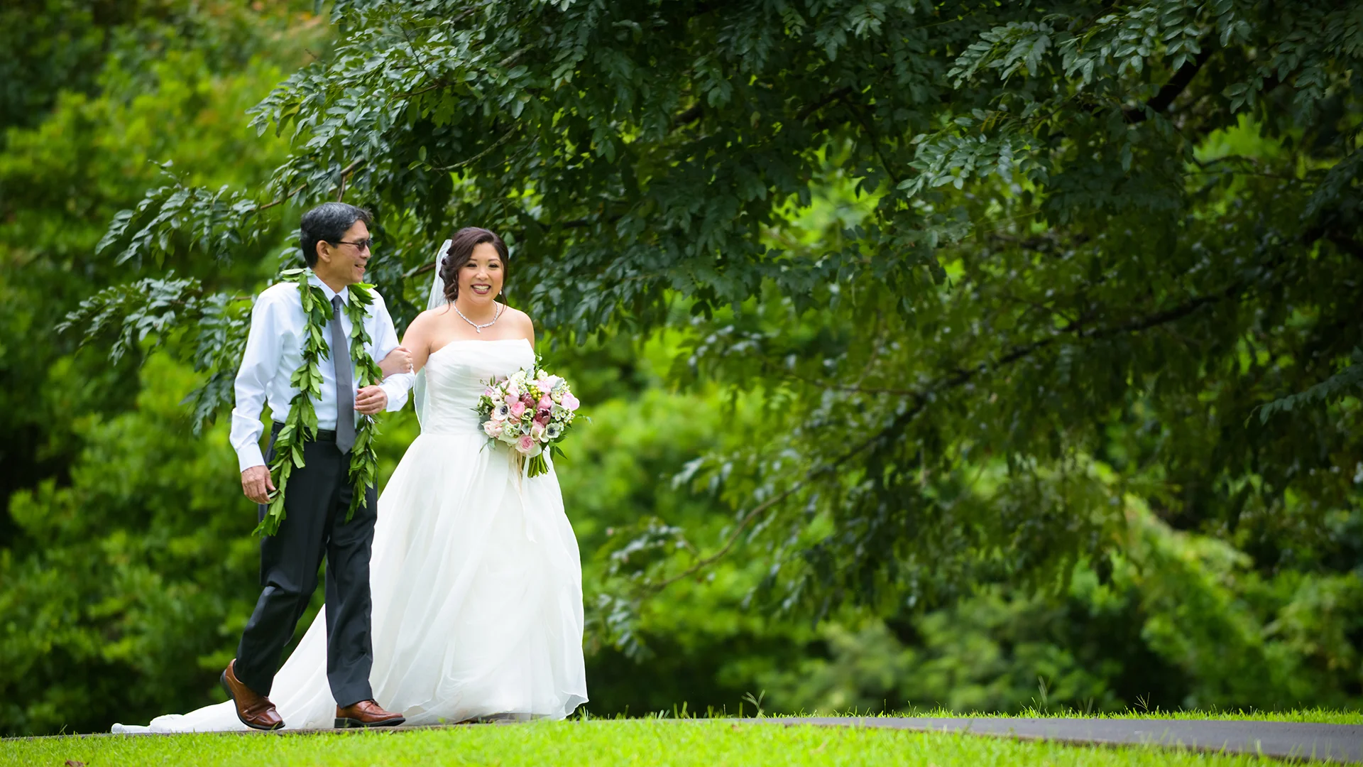Father walking his daughter down the aisle at Koolau Ballrooms Outdoor Garden in Hawaii.