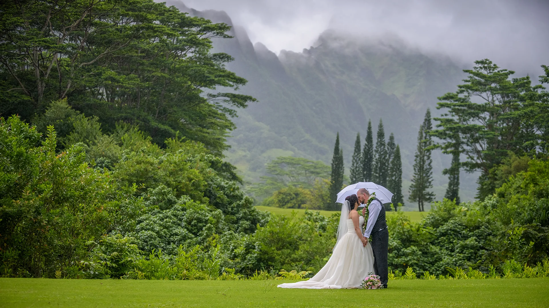 A couple’s session with the majestic Koolau mountains in the background at the Koolau ballroom in Hawaii.