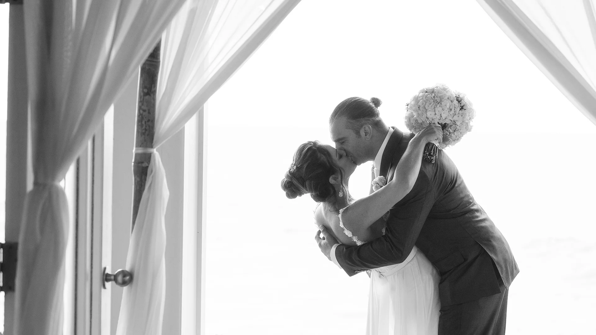 The bride and groom’s first kiss at the Turtle Bay Resort in Kahuku, Hawaii on the North Shore.