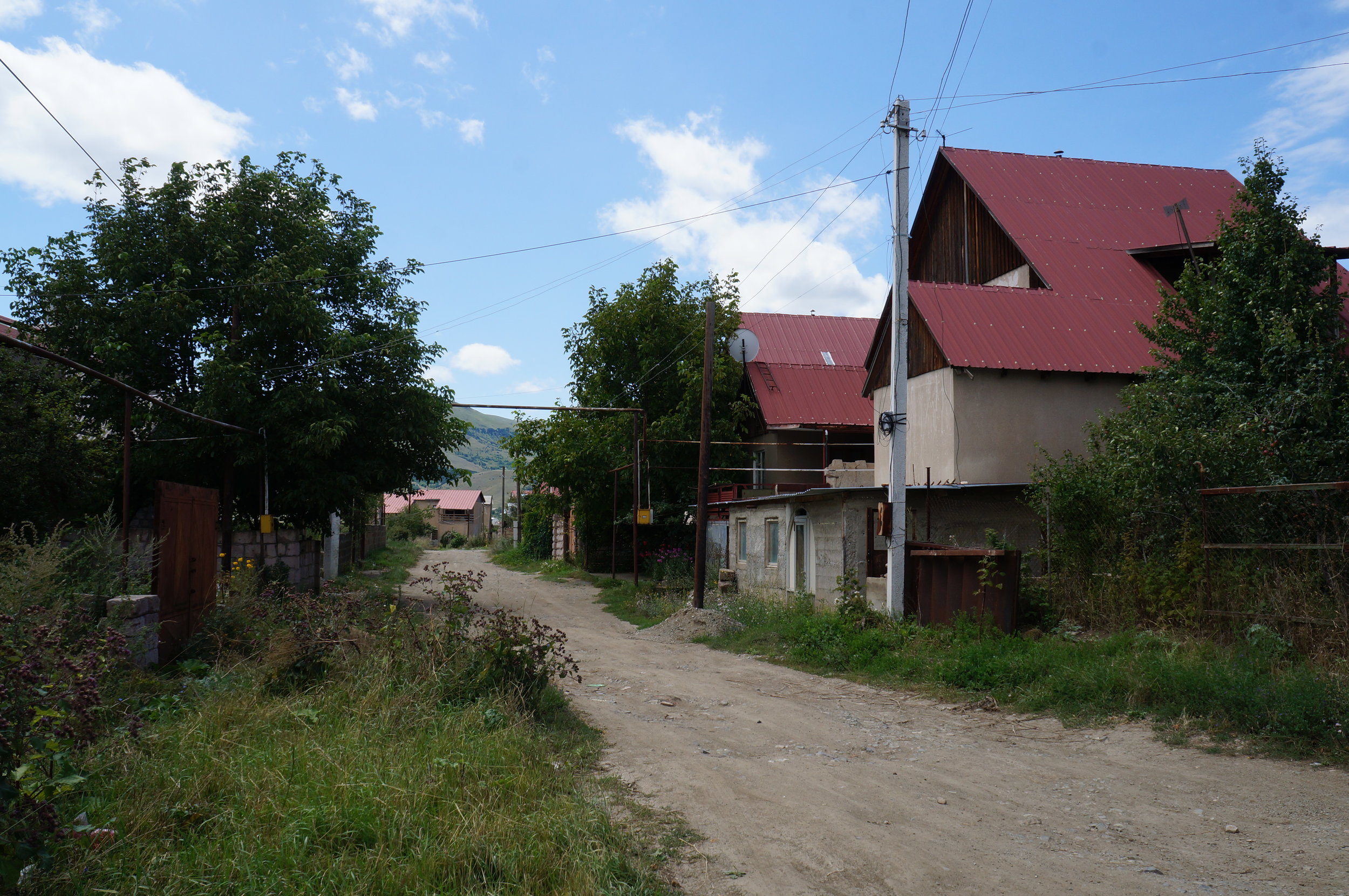 A large Swiss-constructed house in Spitak, built for two families, with its characteristic red roof.   