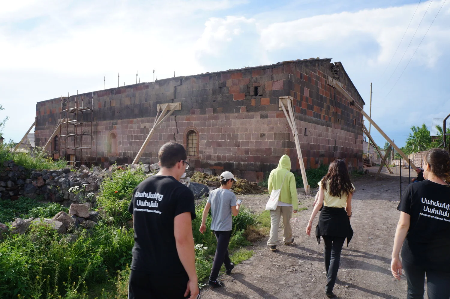Border to Border, a project that involves American and Armenian volunteers teaching about healthy living passes by a church being renovated.