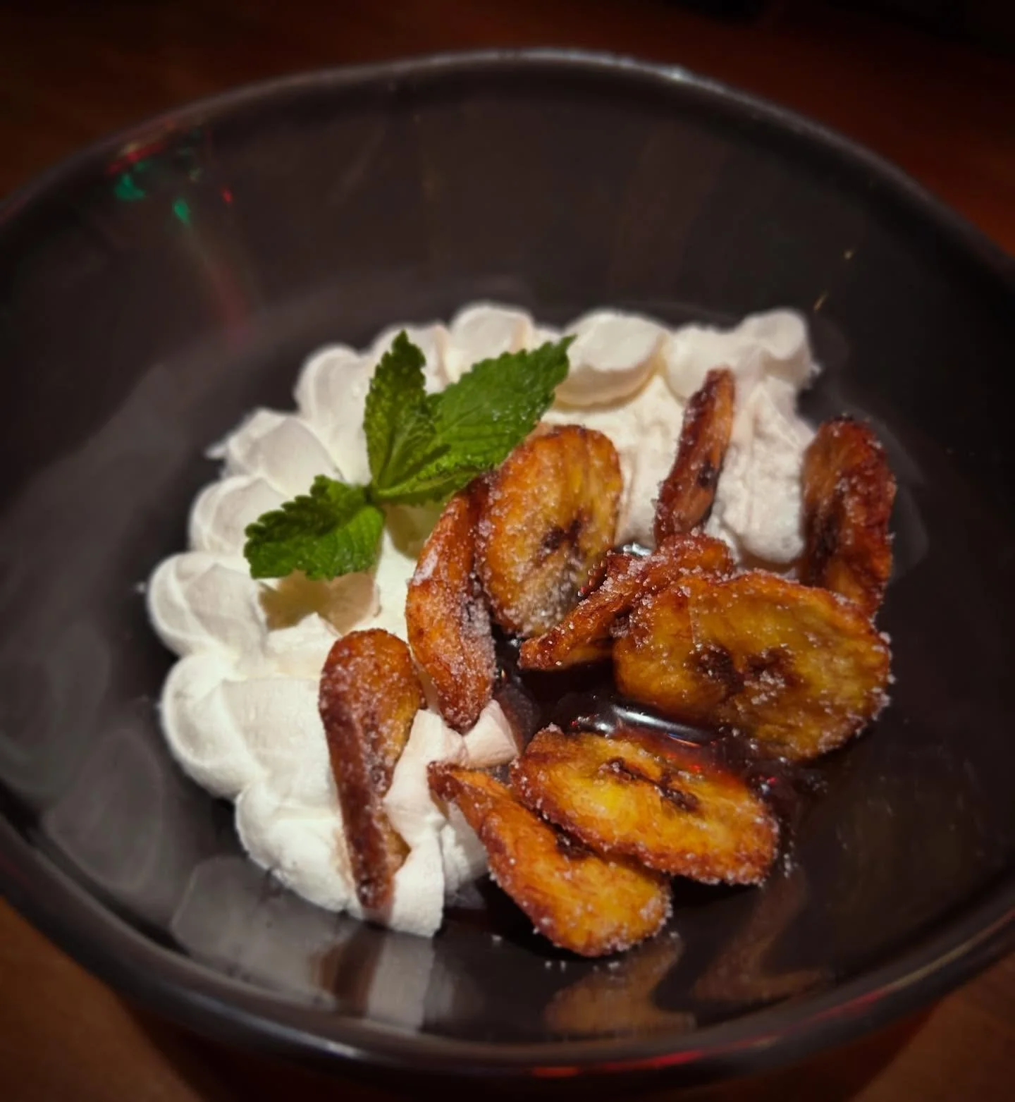 Nothing says cozy like a nice rich chocolate-y dessert. Chocolate pot de creme with Malta caramel, whipped cream, sweet plantain chips, and a hint of mint. 🍫🍧🌱🍌😋

#thisishowwedoit #ticktick BOOM💥