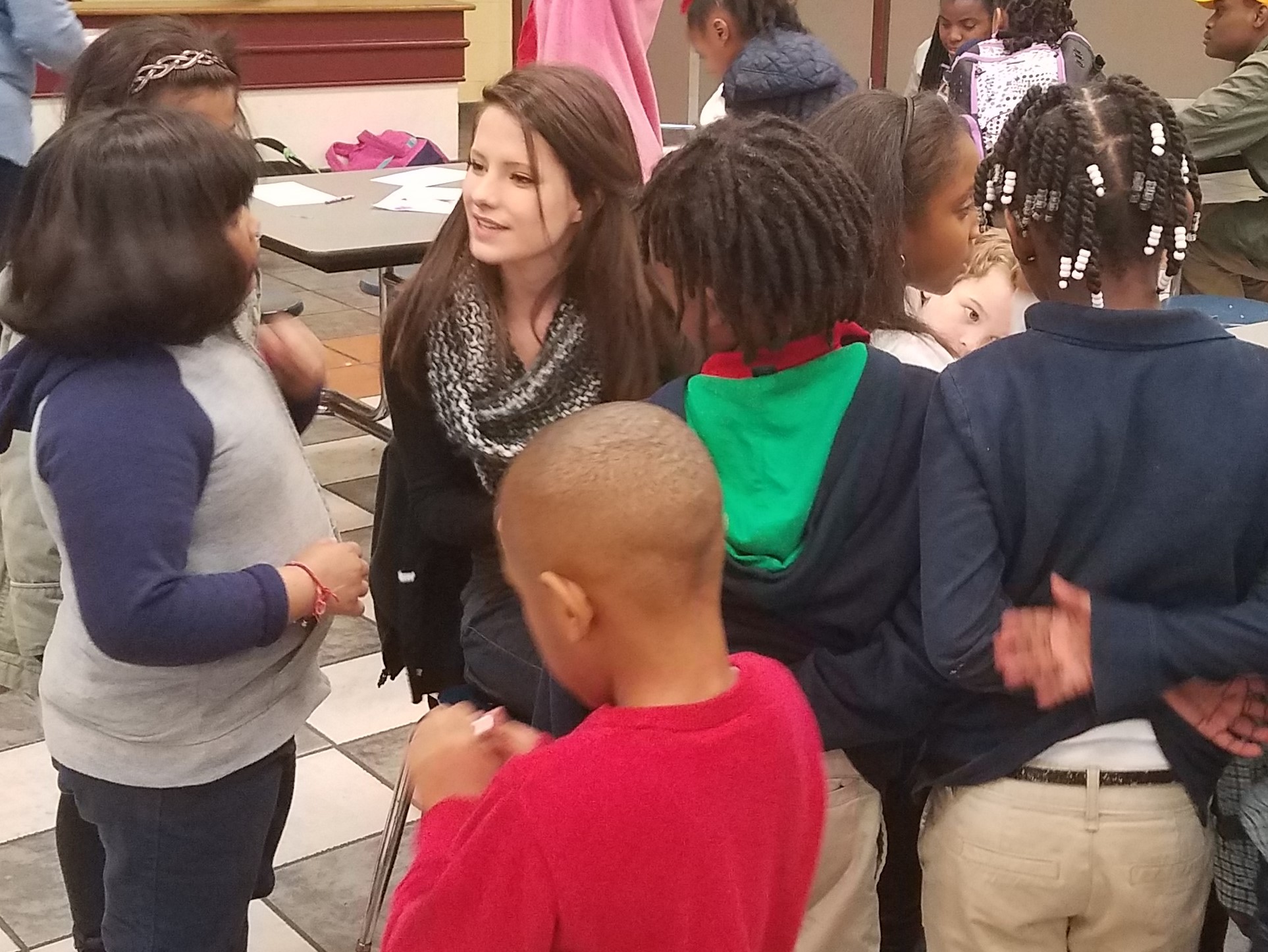  Rebekah Ford listens to children say their memory verses at the Halcyon Elementary  Good News Club® . 